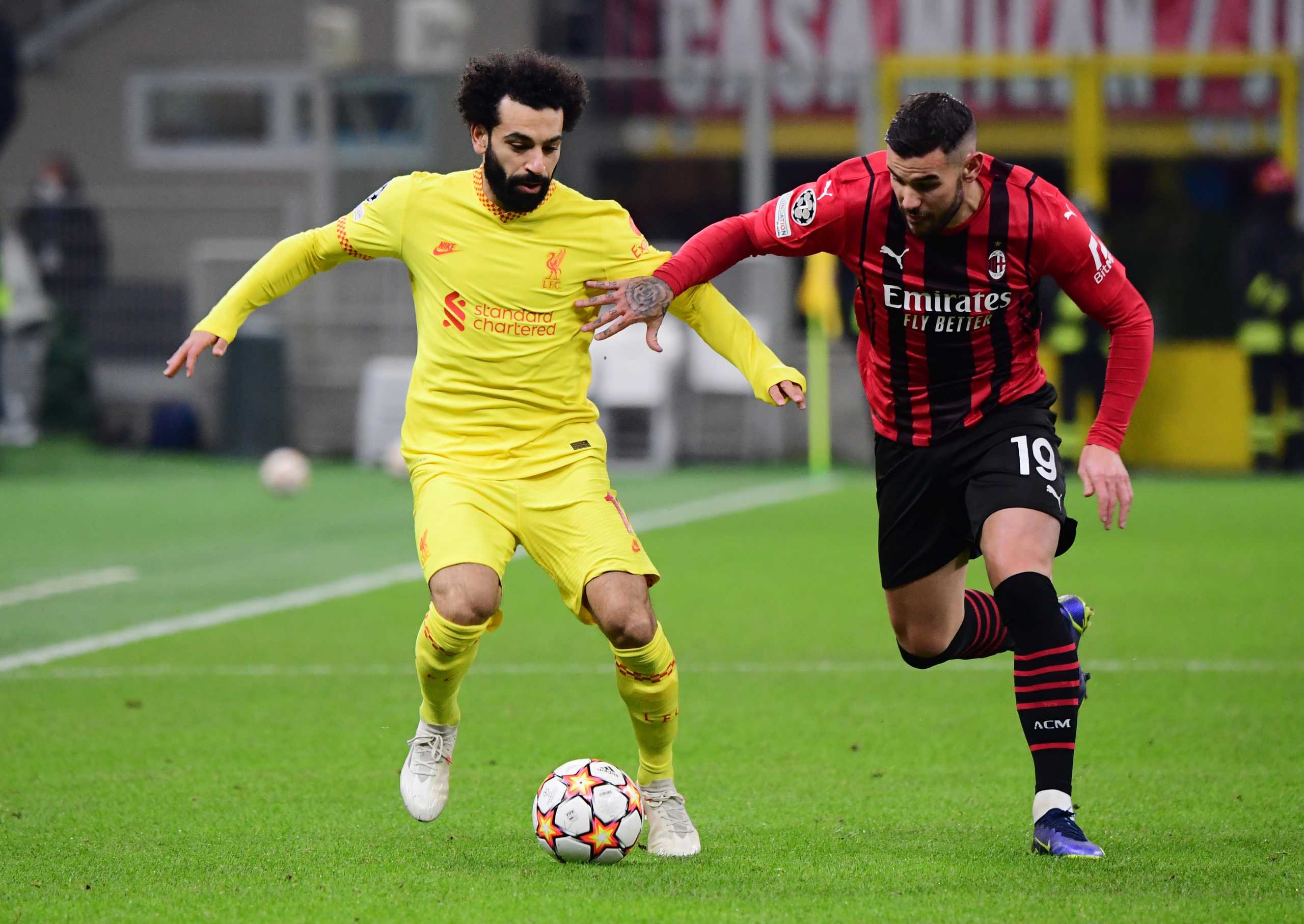 Soccer Football - Champions League - Group B - AC Milan v Liverpool - San Siro, Milan, Italy - December 7, 2021  Liverpool's Mohamed Salah in action with AC Milan's Theo Hernandez REUTERS