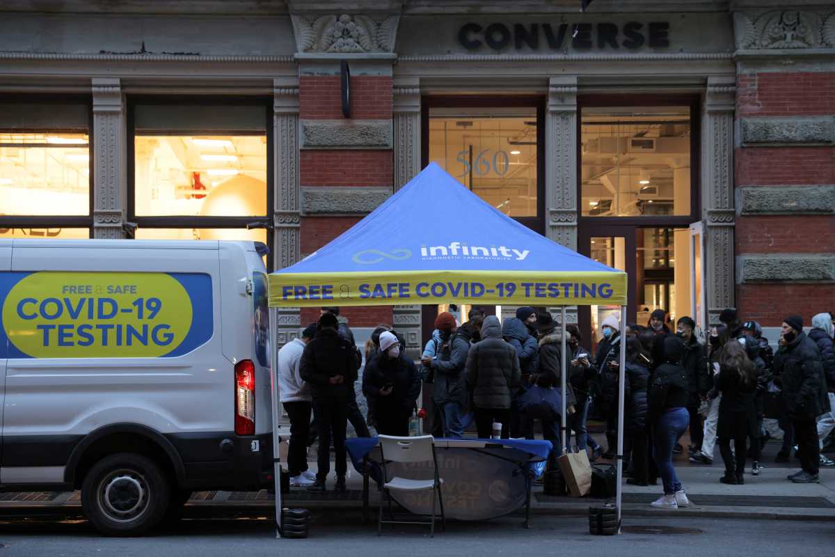 People queue for a COVID-19 test on Broadway in SoHo as the Omicron coronavirus variant continues to spread in Manhattan, New York City, U.S., December 27, 2021. REUTERS