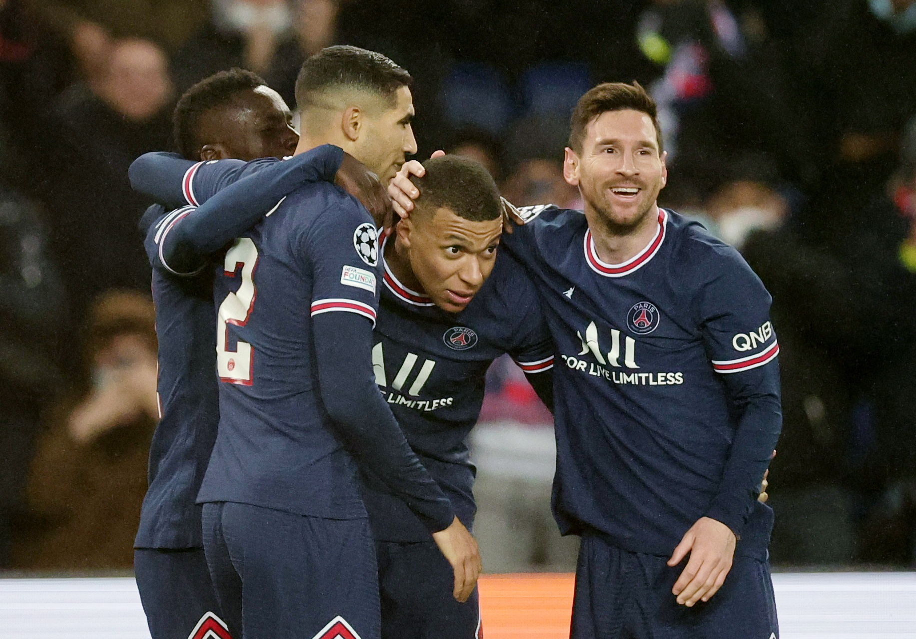 Soccer Football - Champions League - Group A - Paris St Germain v Club Brugge - Parc des Princes, Paris, France - December 7, 2021  Paris St Germain's Lionel Messi celebrates scoring their third goal with Kylian Mbappe, Idrissa Gueye and Achraf Hakimi REUTERS