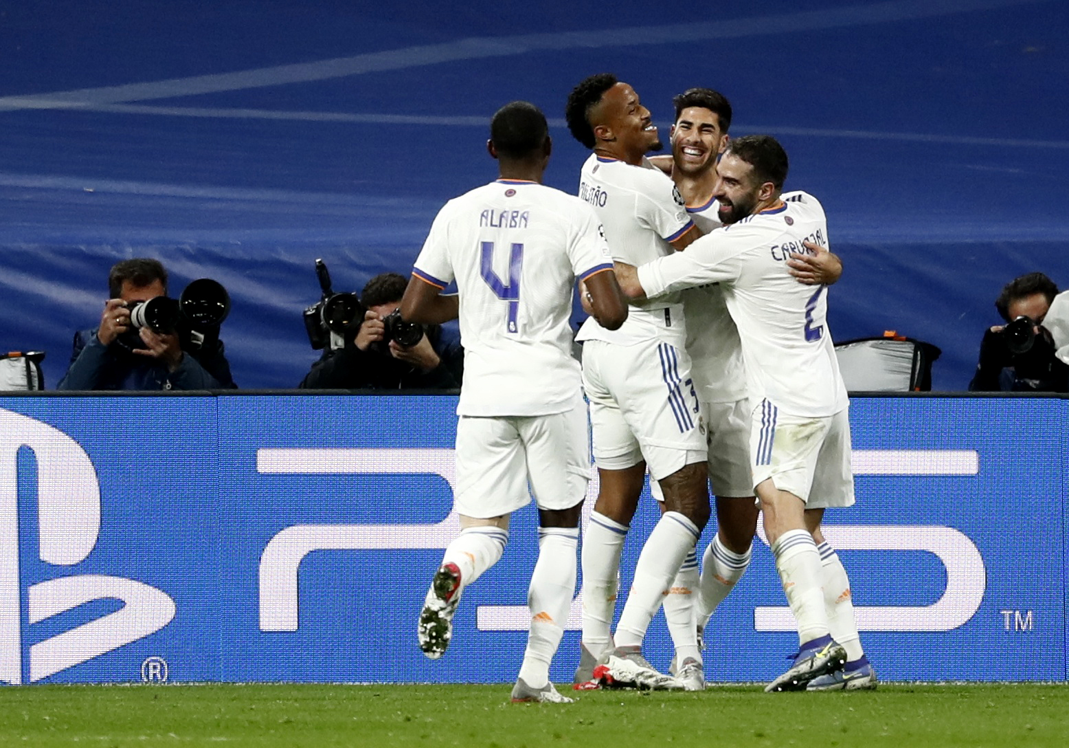Soccer Football - Champions League - Group D - Real Madrid v Inter Milan - Santiago Bernabeu, Madrid, Spain - December 7, 2021 Real Madrid's Marco Asensio celebrates scoring their second goal with teammates REUTERS