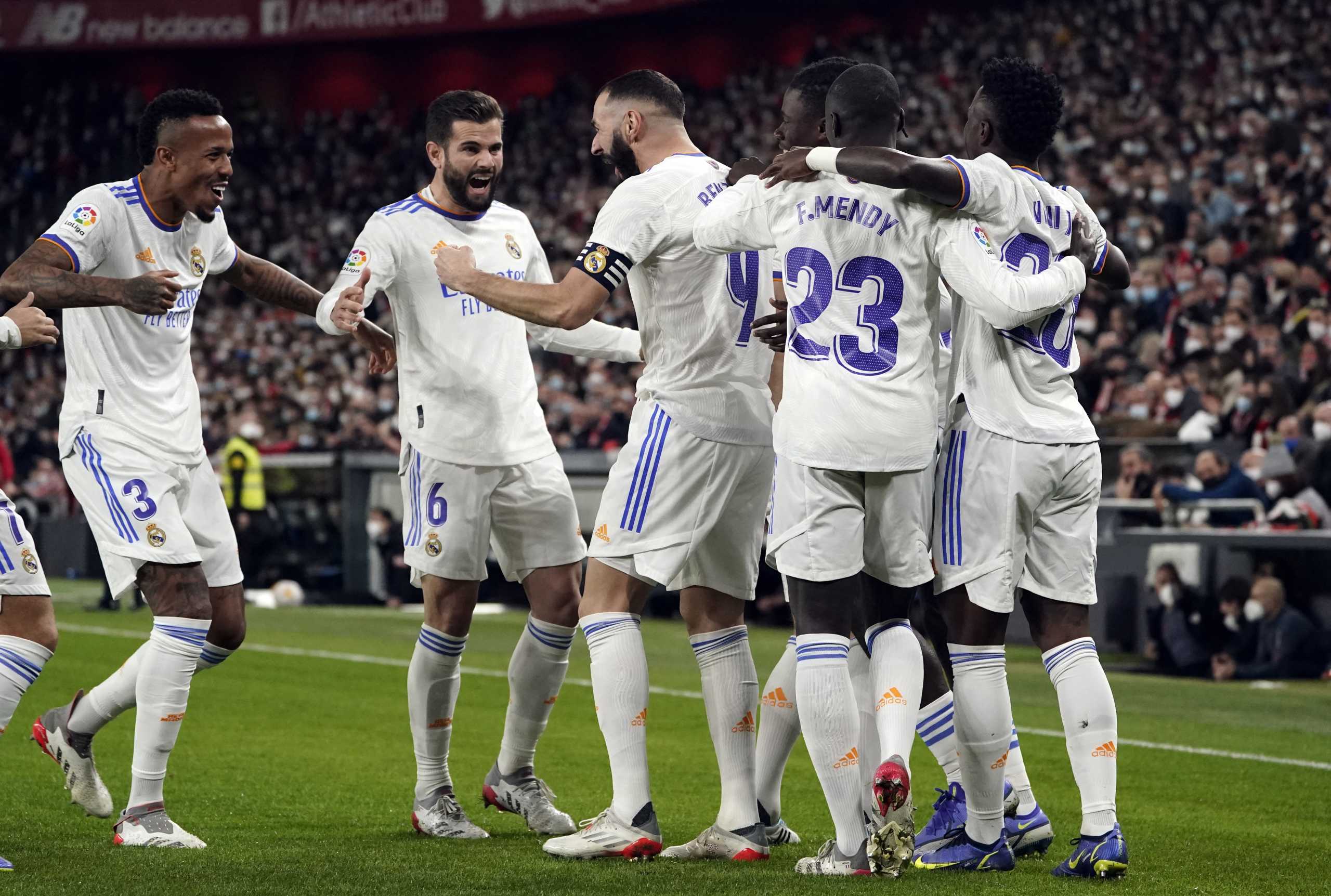 Soccer Football - LaLiga - Athletic Bilbao v Real Madrid - San Mames, Bilbao, Spain - December 22, 2021 Real Madrid's Karim Benzema celebrates scoring their first goal with teammates REUTERS