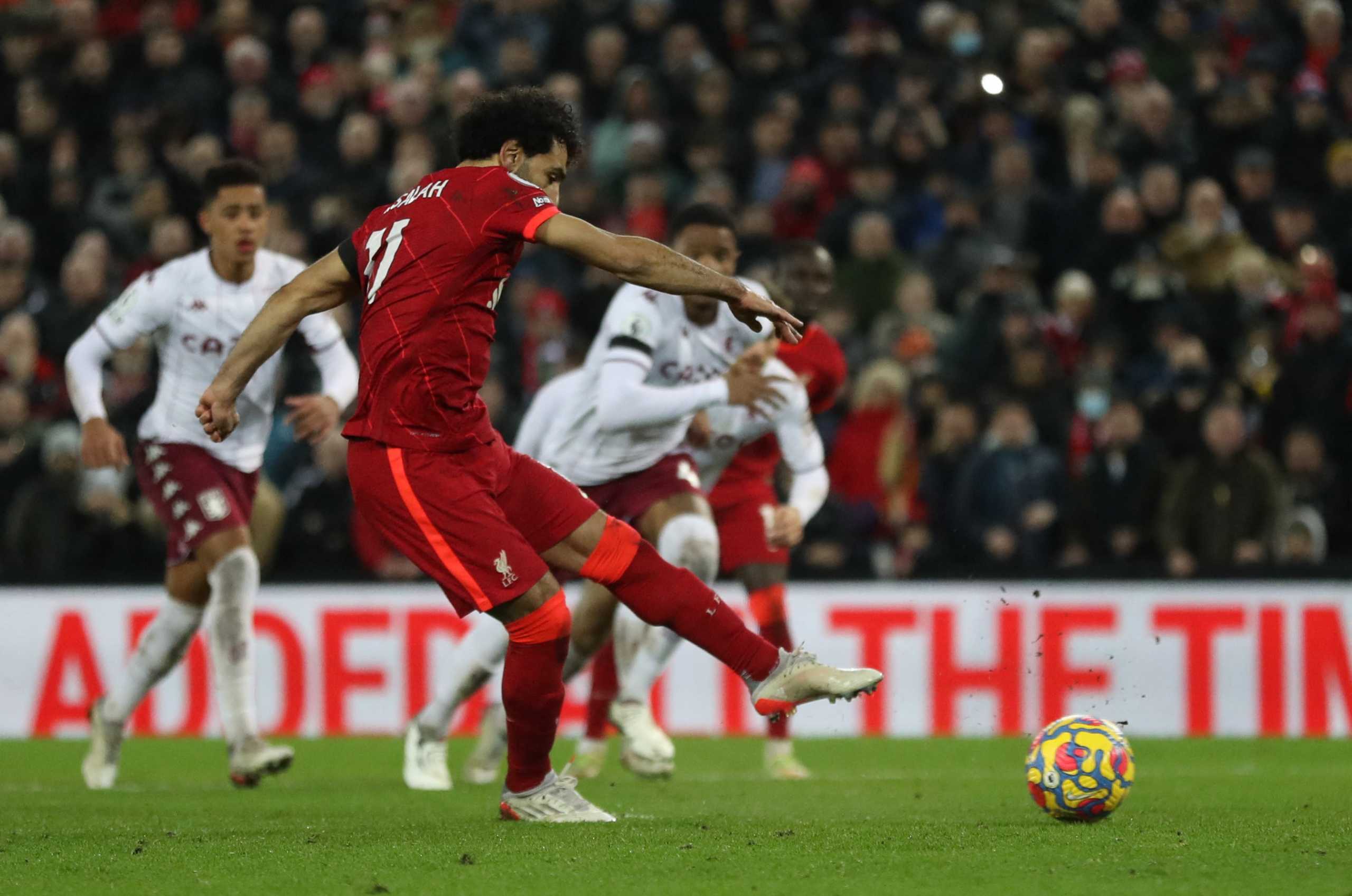 Soccer Football - Premier League - Liverpool v Aston Villa - Anfield, Liverpool, Britain - December 11, 2021 Liverpool's Mohamed Salah scores their first goal from the penalty spot REUTERS