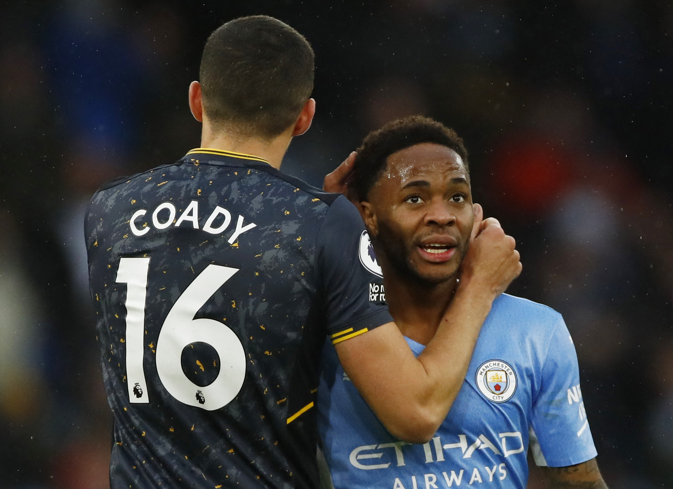 Soccer Football - Premier League - Manchester City v Wolverhampton Wanderers - Etihad Stadium, Manchester, Britain - December 11, 2021 Manchester City's Raheem Sterling with Wolverhampton Wanderers' Conor Coady after the match Action Images via Reuters
