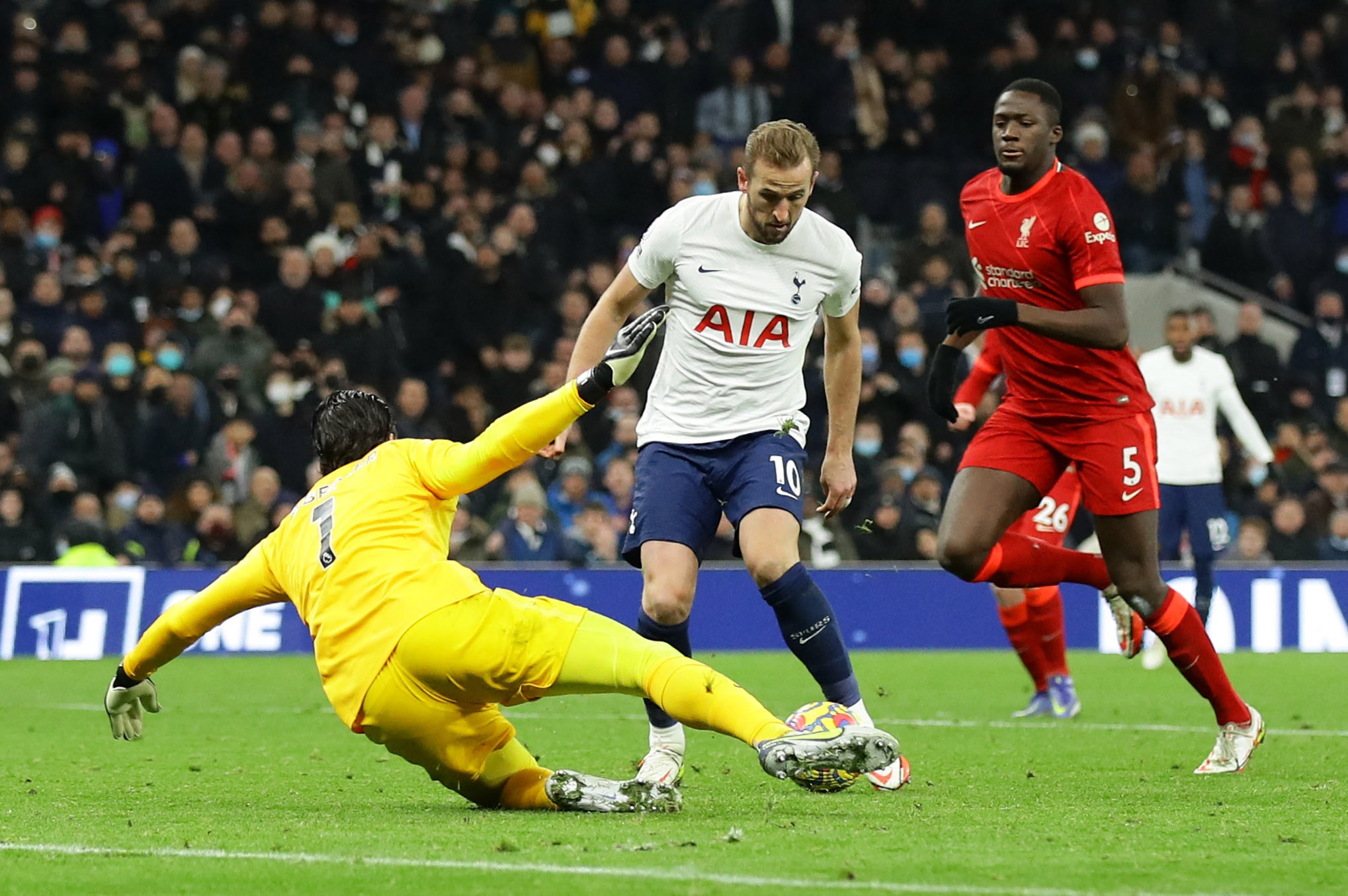 Soccer Football - Premier League - Tottenham Hotspur v Liverpool - Tottenham Hotspur Stadium, London Britain - December 19, 2021 Tottenham Hotspur's Harry Kane in action with Liverpool's Alisson REUTERS