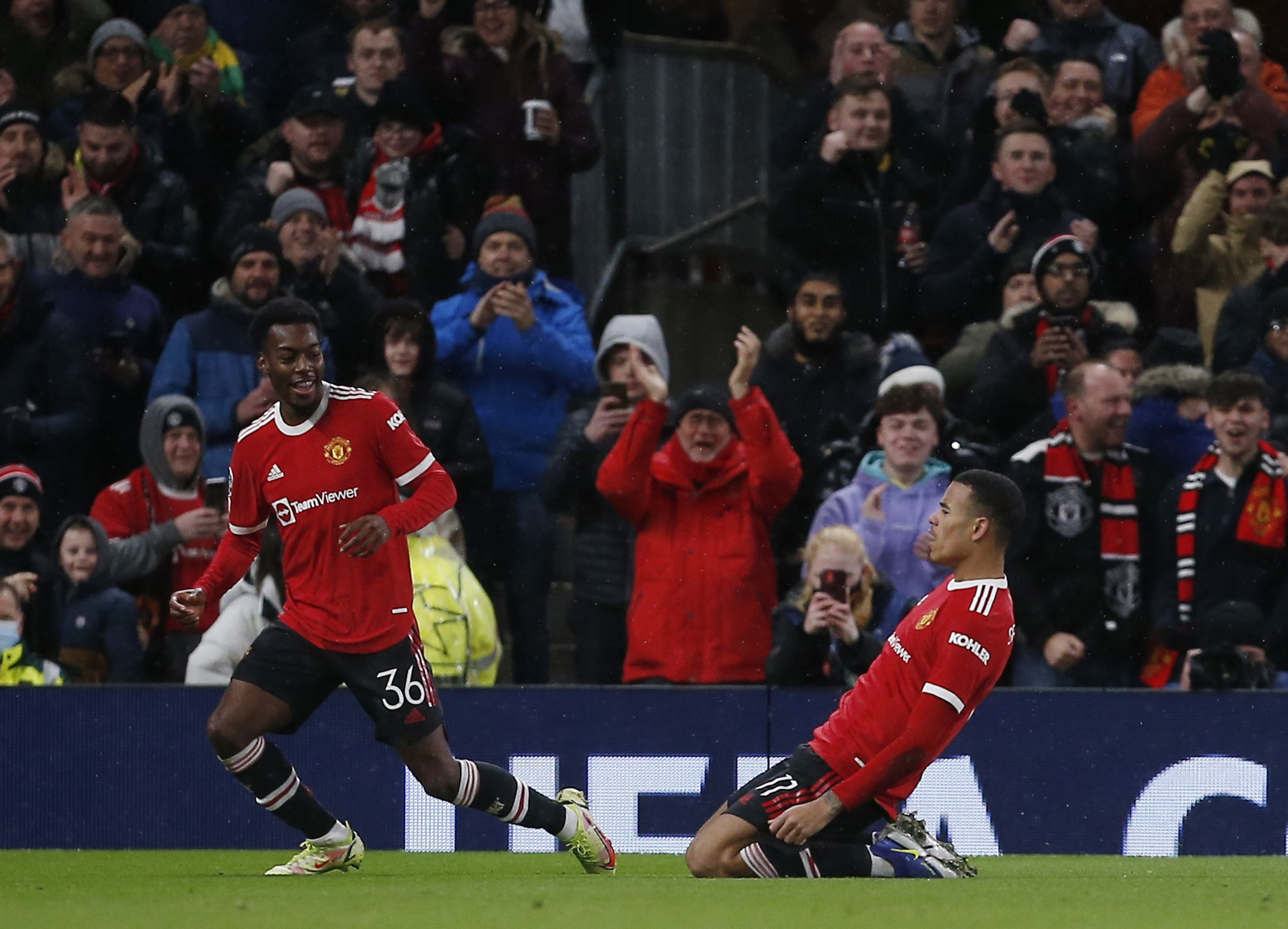Soccer Football - Champions League - Group F - Manchester United v Young Boys - Old Trafford, Manchester, Britain - December 8, 2021 Manchester United's Mason Greenwood celebrates scoring their first goal with Anthony Elanga REUTERS