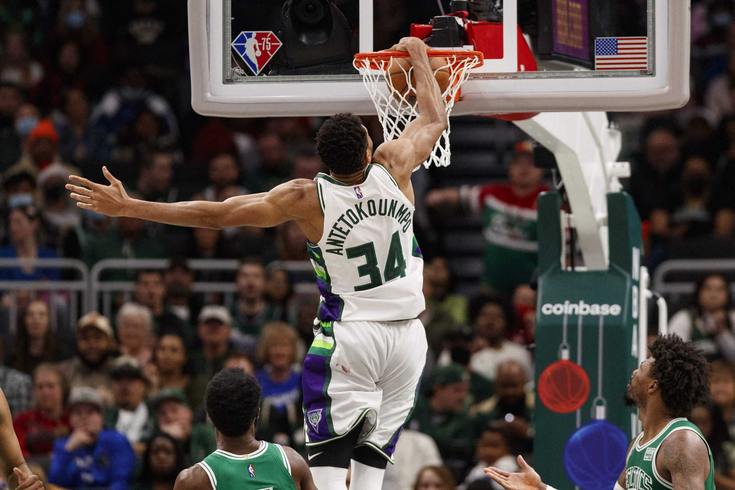 Dec 25, 2021; Milwaukee, Wisconsin, USA;  Milwaukee Bucks forward Giannis Antetokounmpo (34) dunks during the fourth quarter against the Boston Celtics at Fiserv Forum. Mandatory Credit: Jeff Hanisch-USA TODAY Sports