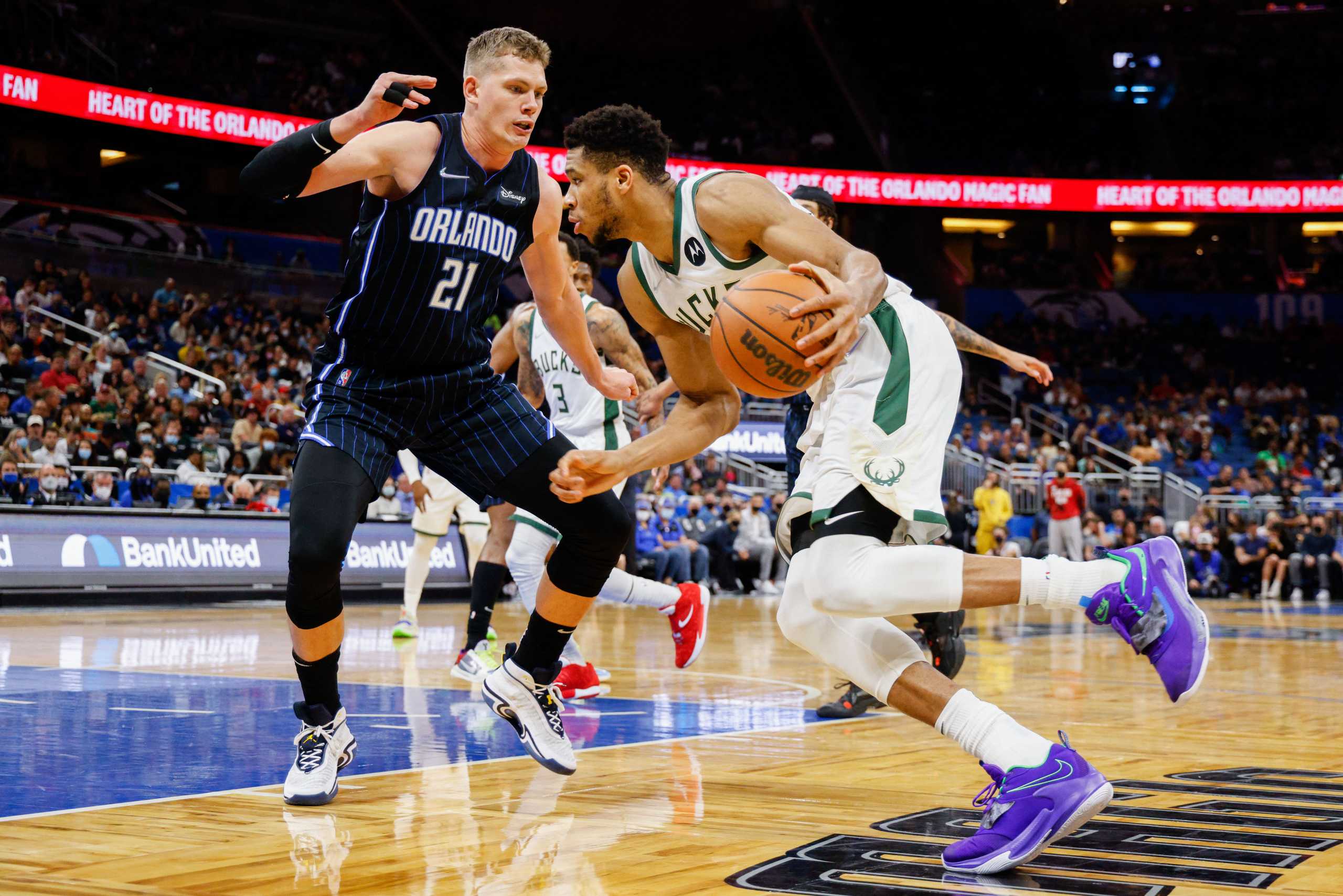 Dec 28, 2021; Orlando, Florida, USA; Milwaukee Bucks forward Giannis Antetokounmpo (34) drives to to the basket past Orlando Magic center Moritz Wagner (21) in the second half at Amway Center. Mandatory Credit: Nathan Ray Seebeck-USA TODAY Sports