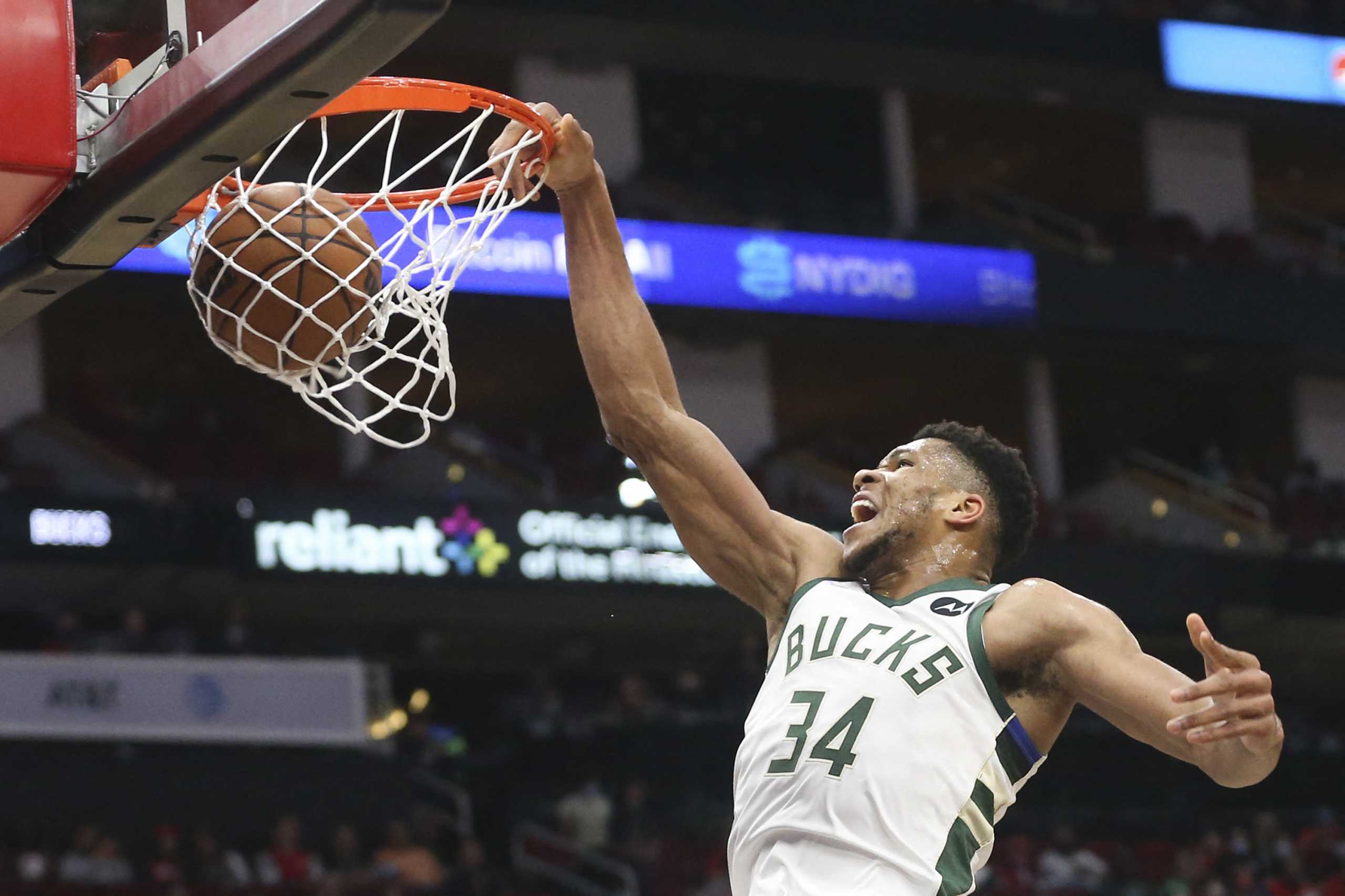 Dec 10, 2021; Houston, Texas, USA;  Milwaukee Bucks forward Giannis Antetokounmpo (34) dunks against the Houston Rockets in the first quarter at Toyota Center. Mandatory Credit: Thomas Shea-USA TODAY Sports