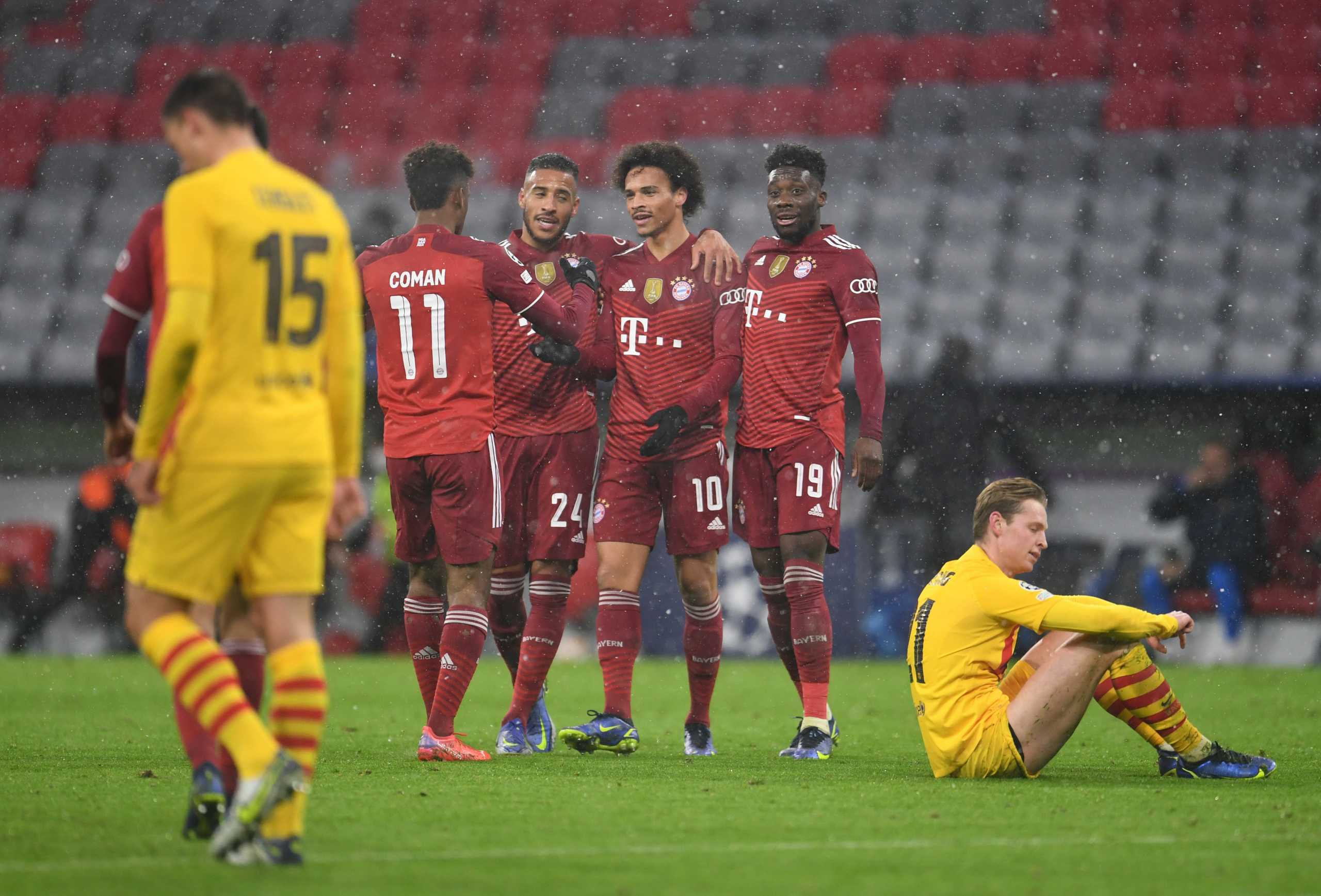 Soccer Football - Champions League - Group E - Bayern Munich v FC Barcelona - Allianz Arena, Munich, Germany - December 8, 2021 Bayern Munich's Leroy Sane celebrates scoring their second goal with teammates REUTERS