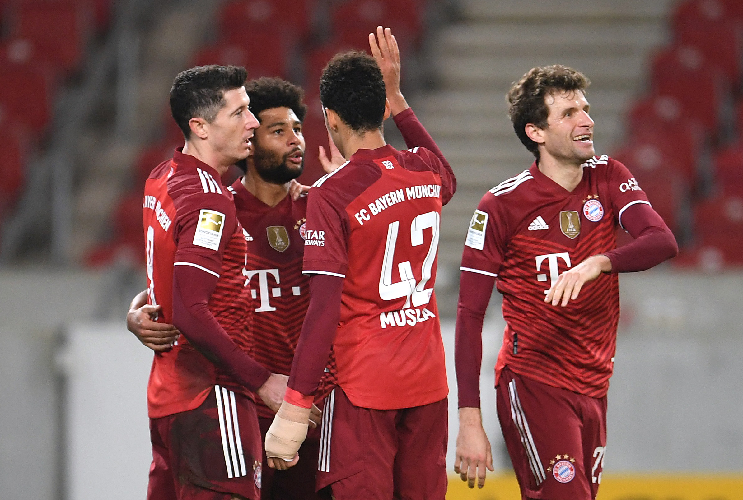 Soccer Football - Bundesliga - VfB Stuttgart v Bayern Munich - Mercedes-Benz Arena, Stuttgart, Germany - December 14, 2021 Bayern Munich's Serge Gnabry celebrates scoring their fifth goal with teammates REUTERS