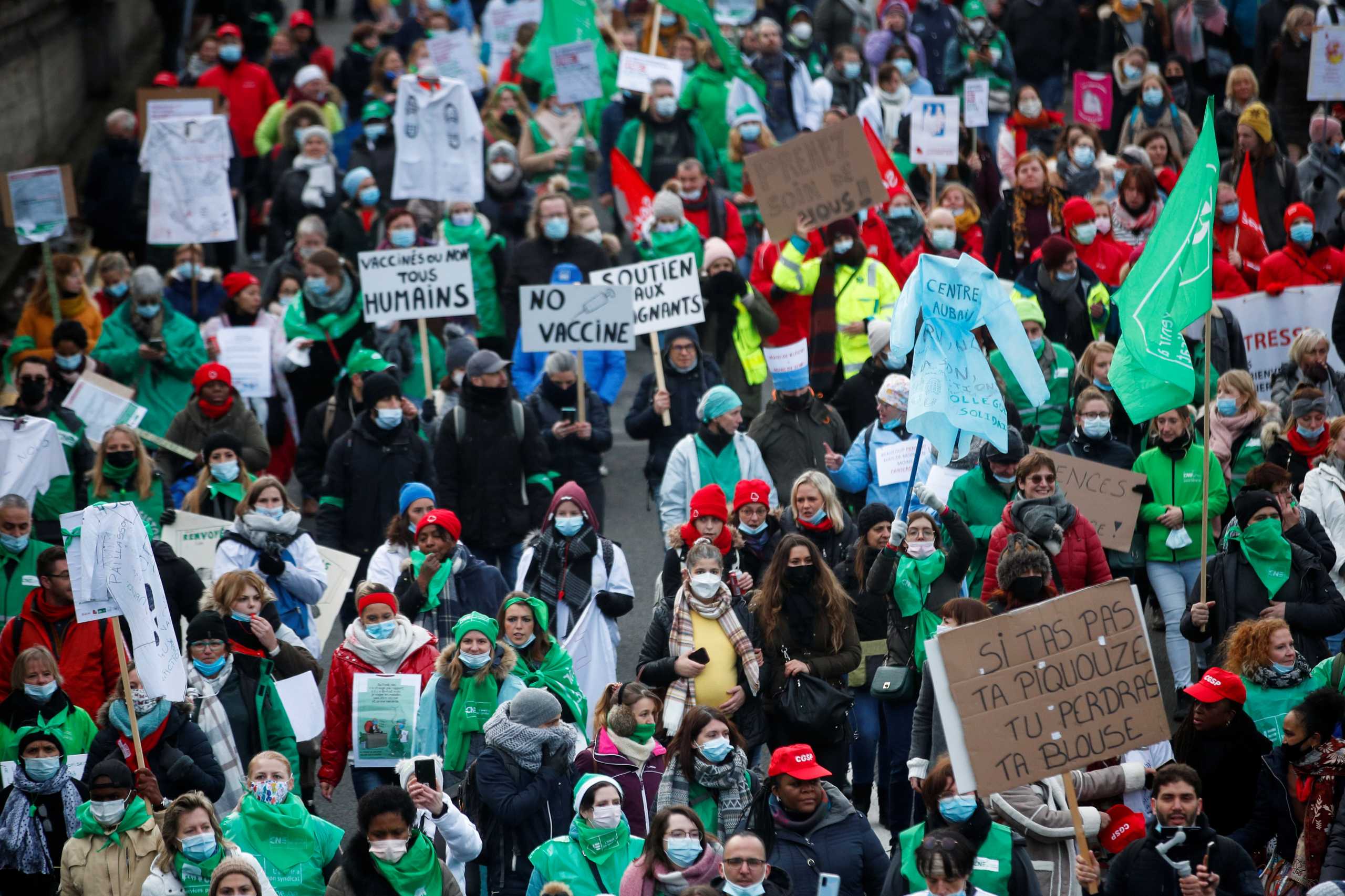 Medical workers attend a demonstration against the Belgian government's restrictions imposed to contain the spread of coronavirus disease (COVID-19) in Brussels, Belgium December 7, 2021. REUTERS