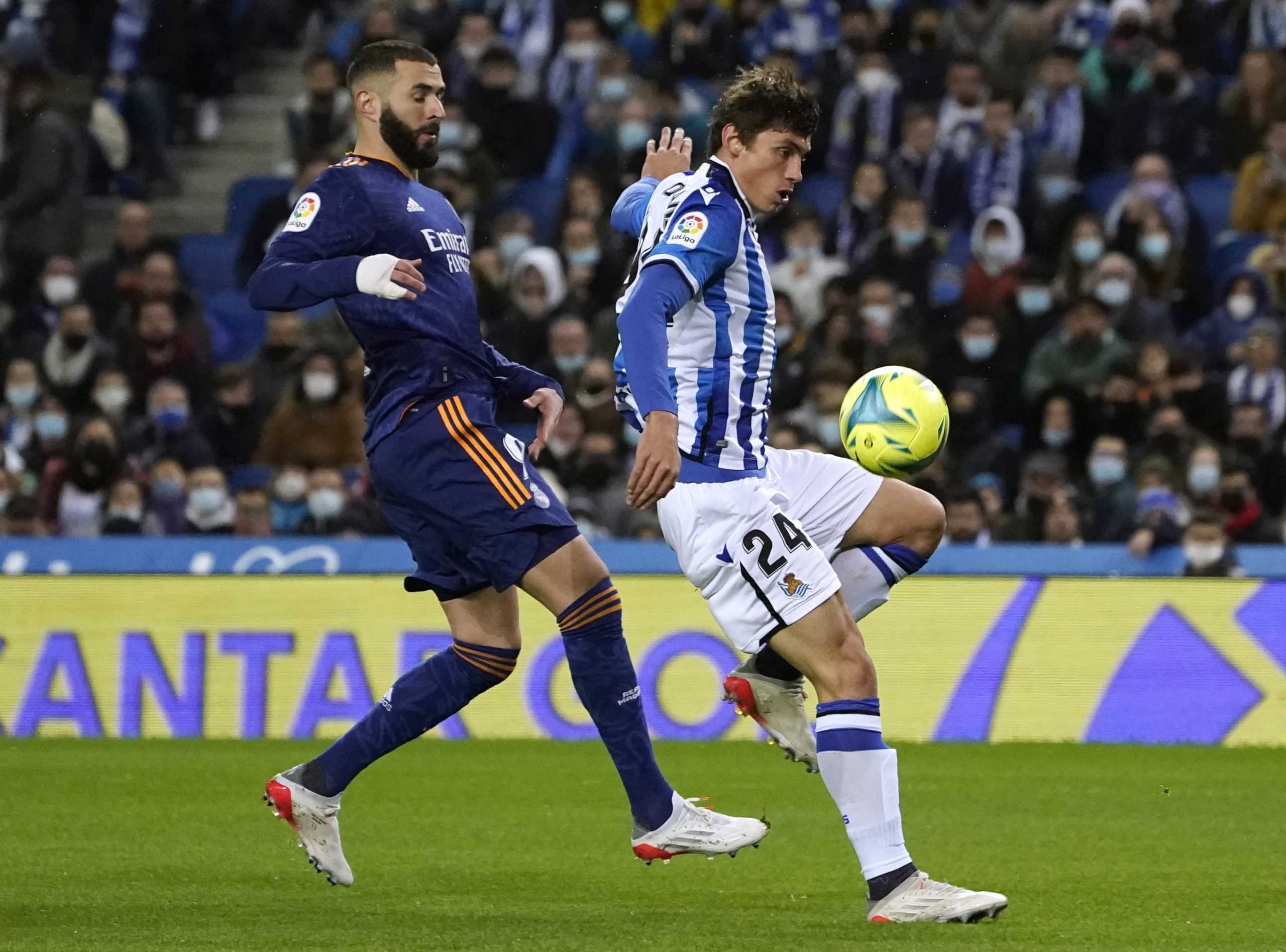 Soccer Football - LaLiga - Real Sociedad v Real Madrid - Reale Arena, San Sebastian, Spain - December 4, 2021 Real Sociedad's Robin Le Normand in action with Real Madrid's Karim Benzema REUTERS