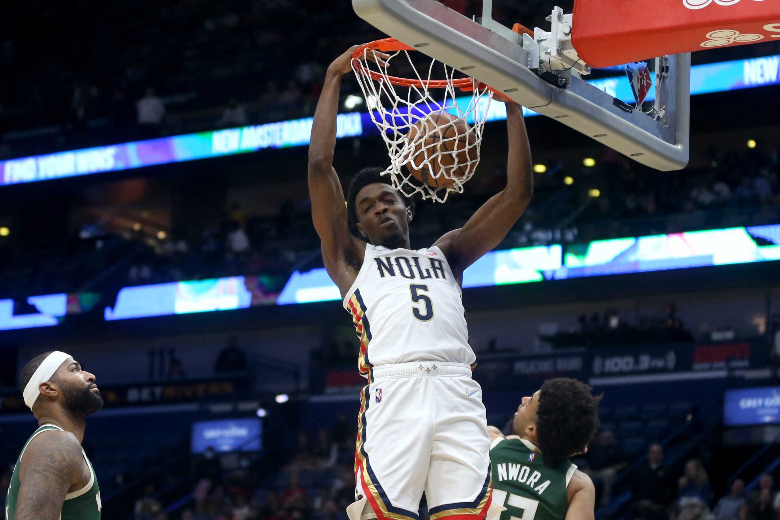 Dec 17, 2021; New Orleans, Louisiana, USA; New Orleans Pelicans forward Herbert Jones (5) dunks against the Milwaukee Bucks in the first quarter at the Smoothie King Center. Mandatory Credit: Chuck Cook-USA TODAY Sports