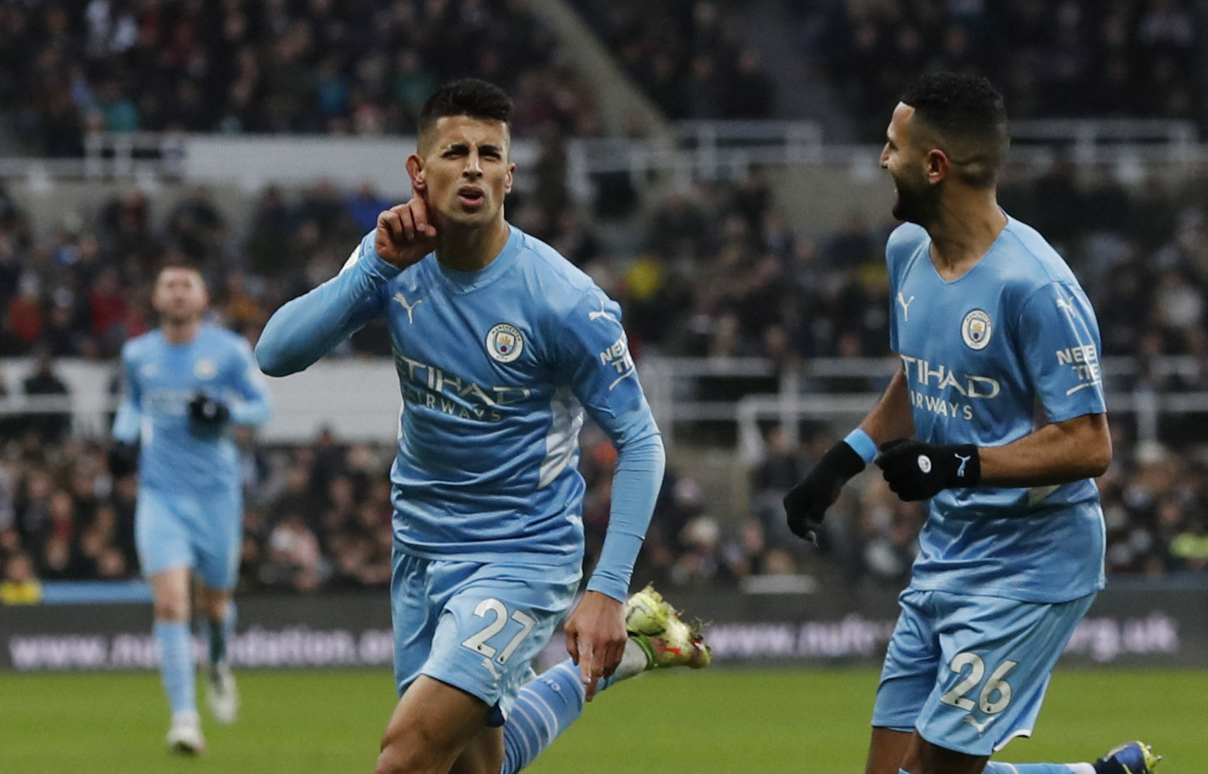 Soccer Football - Premier League - Newcastle United v Manchester City - St James' Park, Newcastle, Britain - December 19, 2021  Manchester City's Joao Cancelo celebrates scoring their second goal with Riyad Mahrez Action Images via Reuters