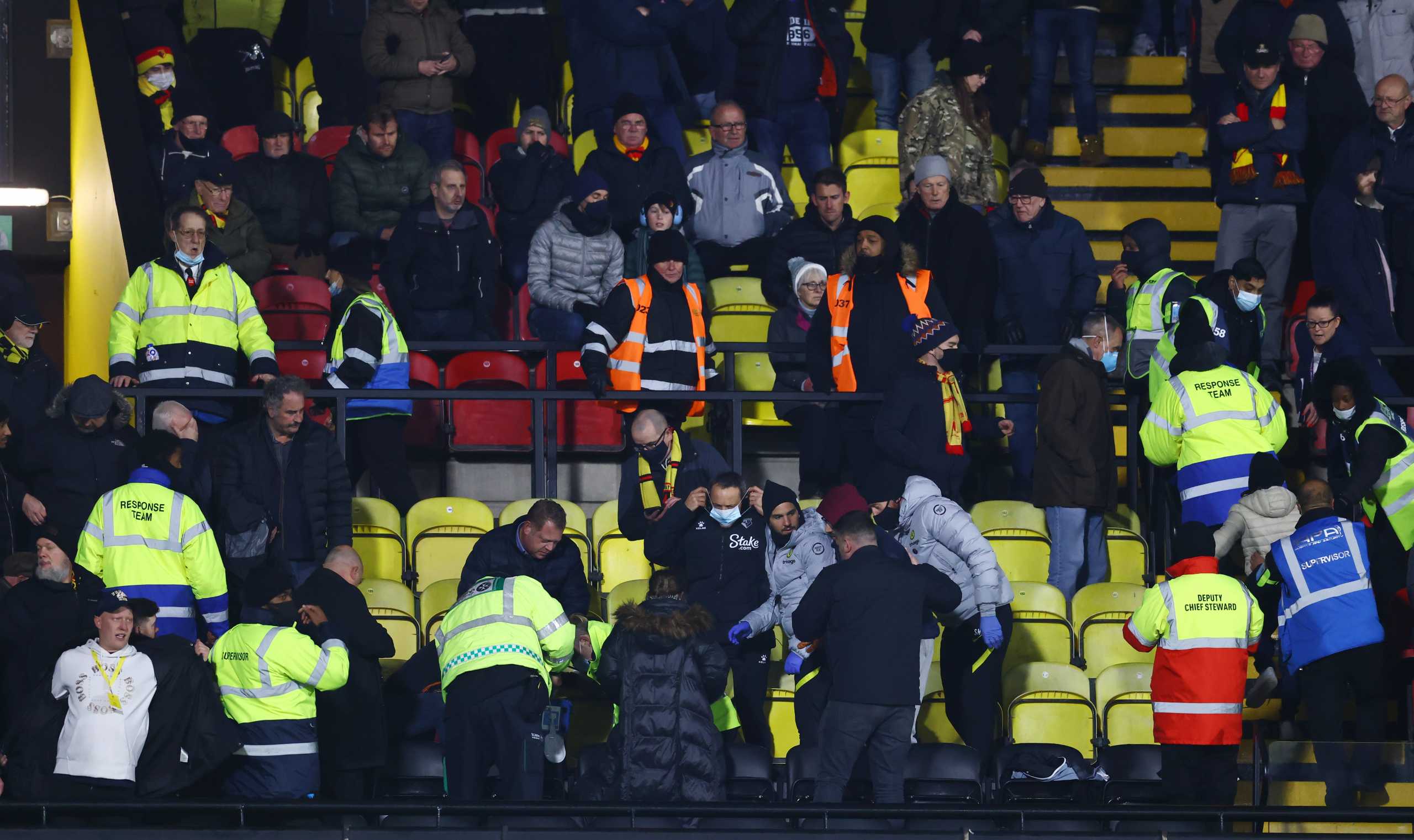 Soccer Football - Premier League - Watford v Chelsea - Vicarage Road, Watford - December 1, 2021 A Watford fan in the stand is given emergency medical help REUTERS