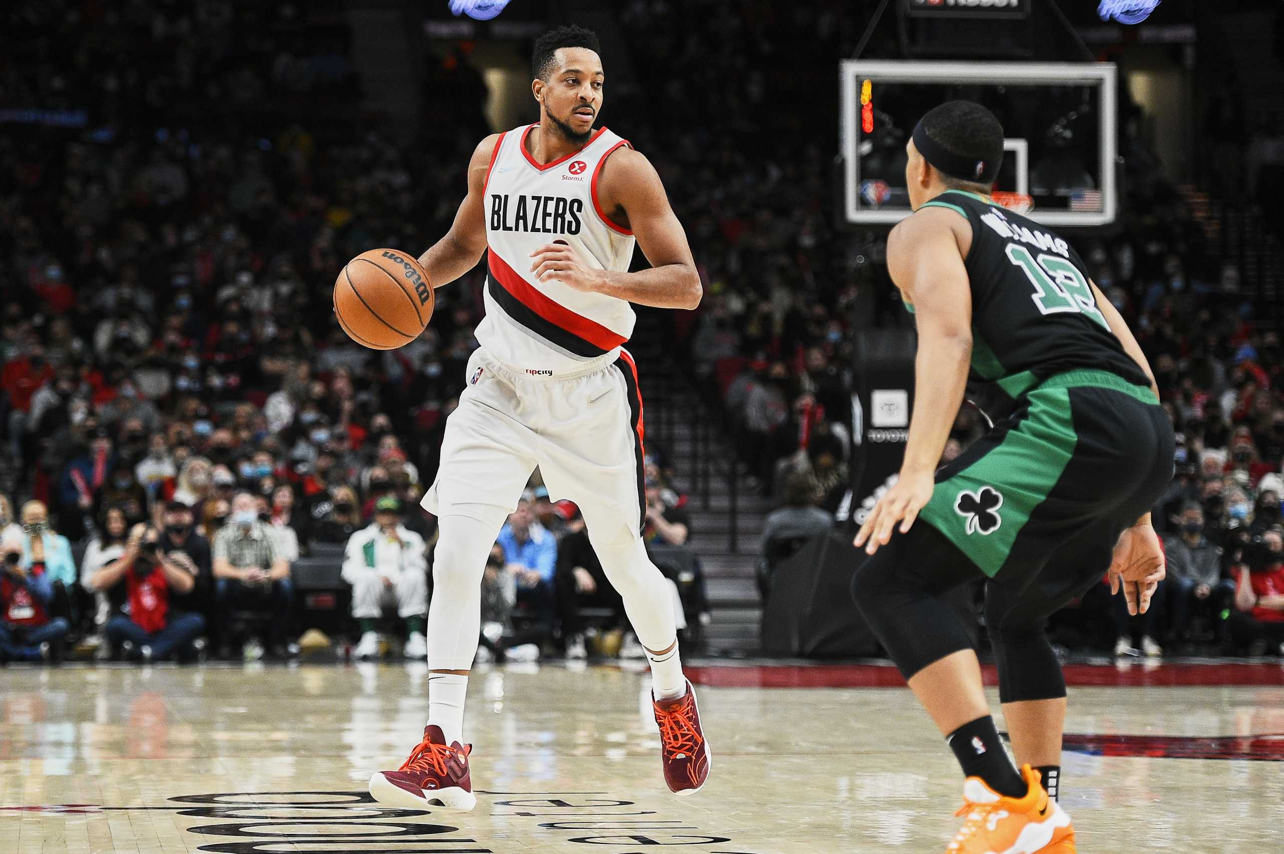 Dec 4, 2021; Portland, Oregon, USA; Portland Trail Blazers guard CJ McCollum (3) dribbles the ball against Boston Celtics forward Grant Williams (12) during the second half at Moda Center. The Celtics won 145-117. Mandatory Credit: Troy Wayrynen-USA TODAY Sports