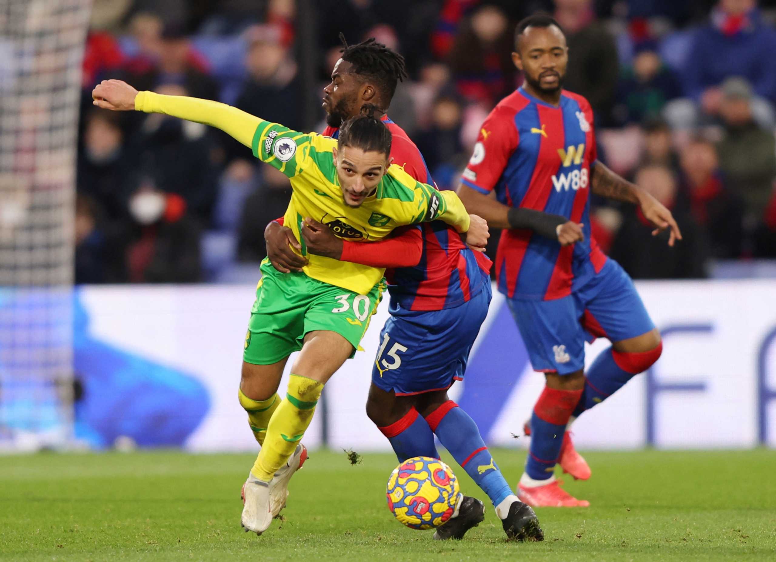 Soccer Football - Premier League - Crystal Palace v Norwich City - Selhurst Park, London, Britain - December 28, 2021 Crystal Palace's Jeffrey Schlupp in action with Norwich City's Dimitris Giannoulis REUTERS
