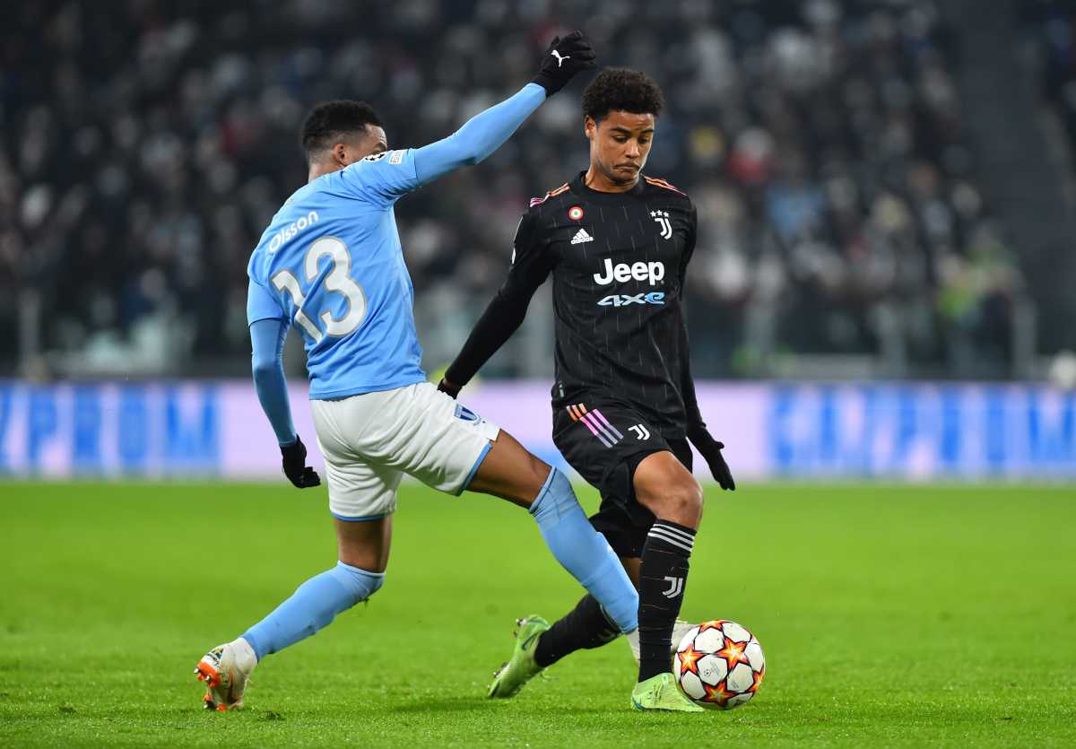 Soccer Football - Champions League - Group H - Juventus v Malmo FF - Allianz Stadium, Turin, Italy - December 8, 2021 Malmo FF's Martin Olsson in action with Juventus' Koni De Winter REUTERS