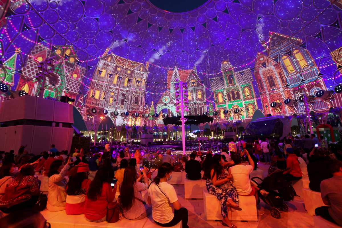 People gather during the official Expo 2020 Christmas Tree Lighting ceremony in Dubai, United Arab Emirates, December 18, 2021. REUTERS