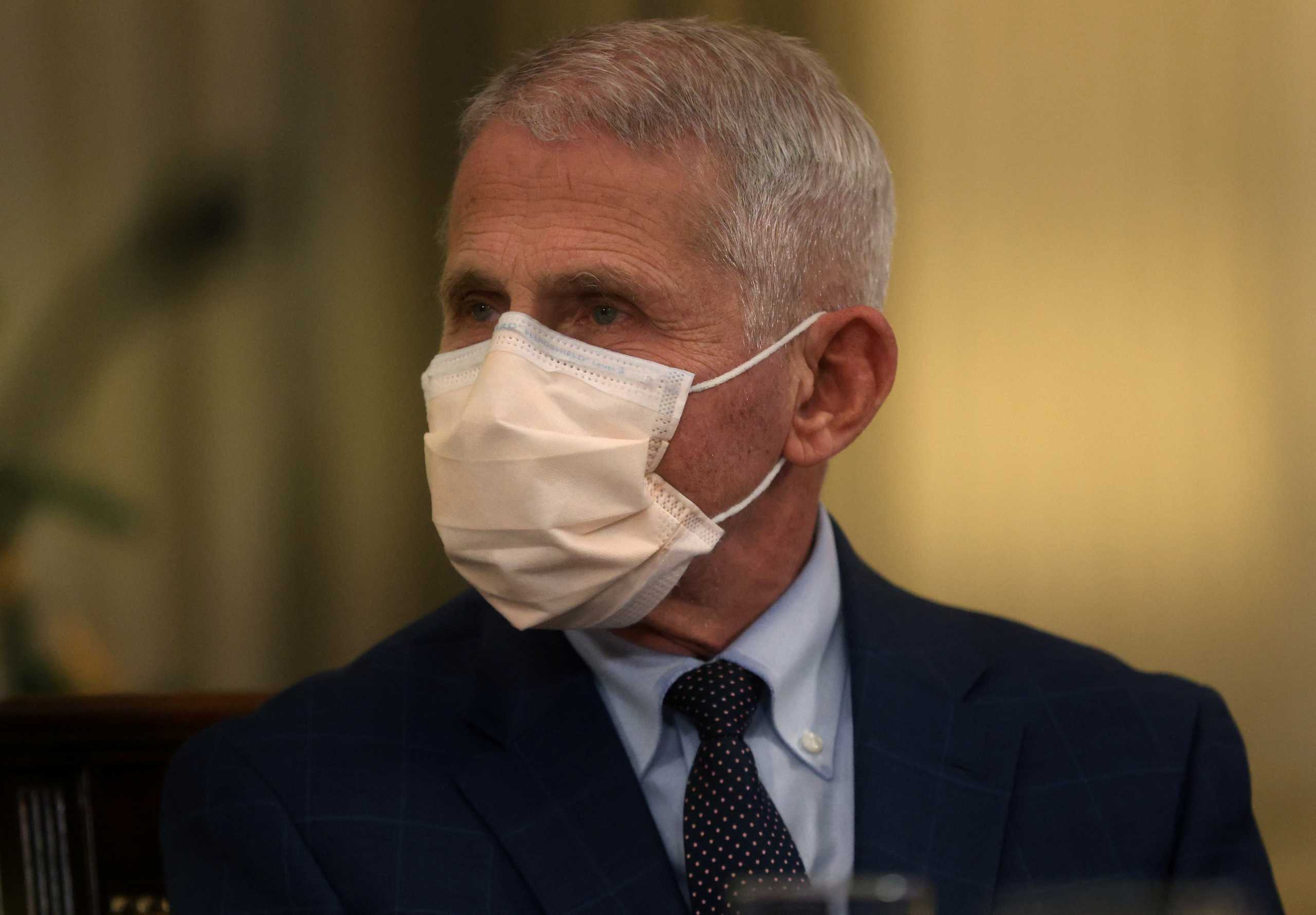 Dr. Anthony Fauci takes part in a meeting with U.S. President Joe Biden and Vice President Kamala Harris and other members of the White House COVID-19 Response Team on developments related to the Omicron COVID-19 variant from the State Dining Room at the White House in Washington, U.S., December 9, 2021. REUTERS