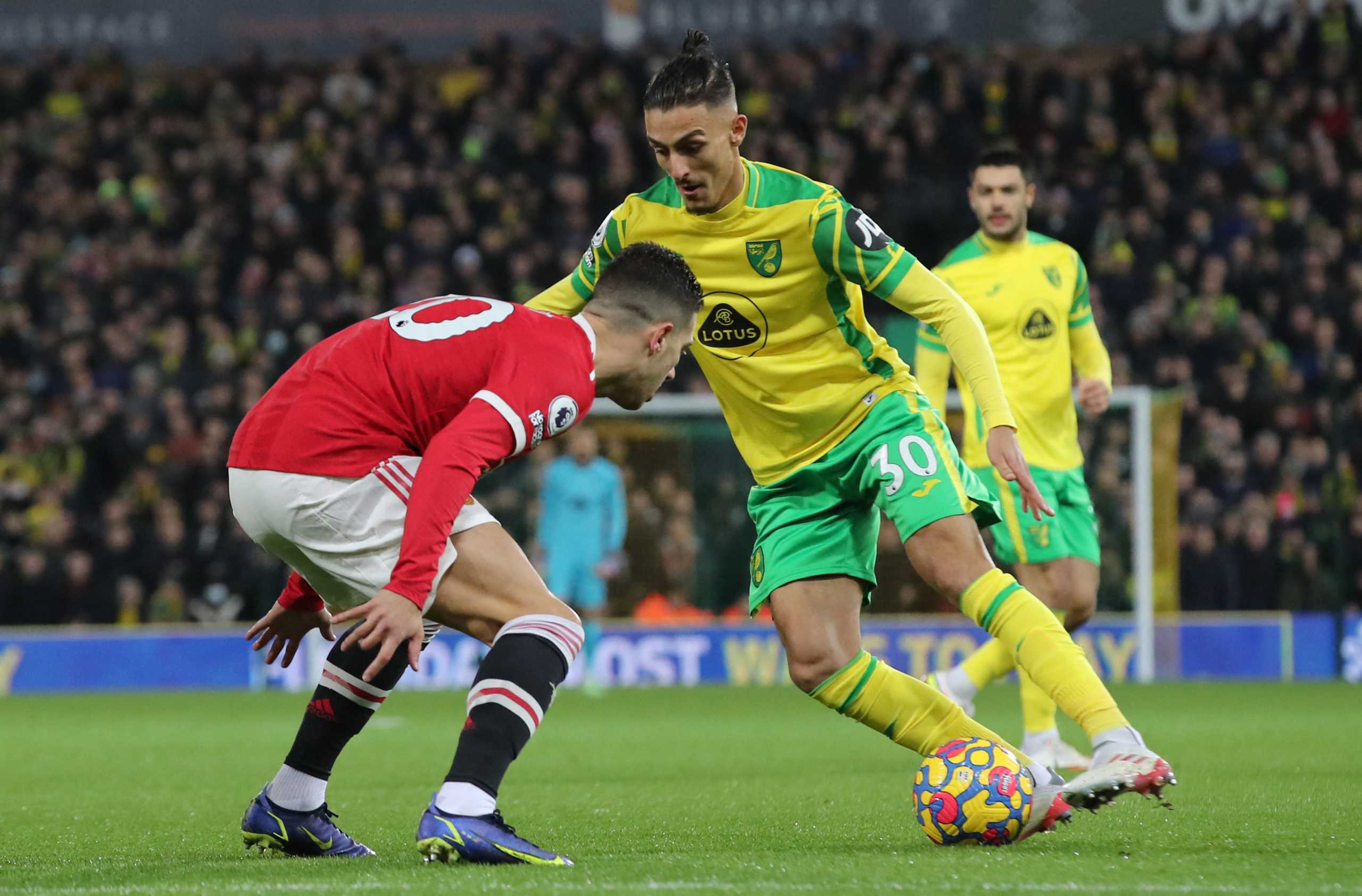 Soccer Football - Premier League - Norwich City v Manchester United - Carrow Road, Norwich, Britain - December 11, 2021 Norwich City's Dimitris Giannoulis in action with Manchester United's Diogo Dalot REUTERS
