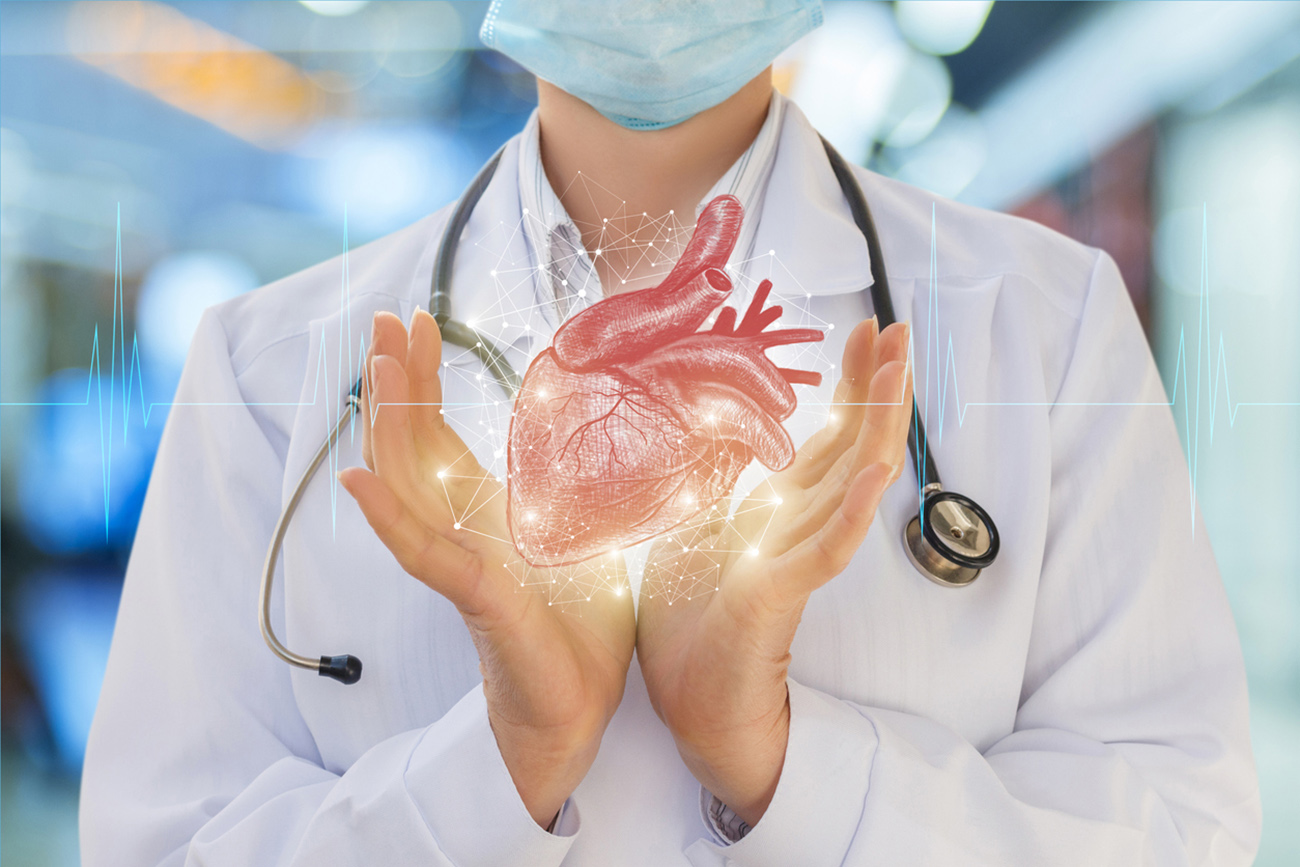 Doctor support heart of the person on the blurred background.