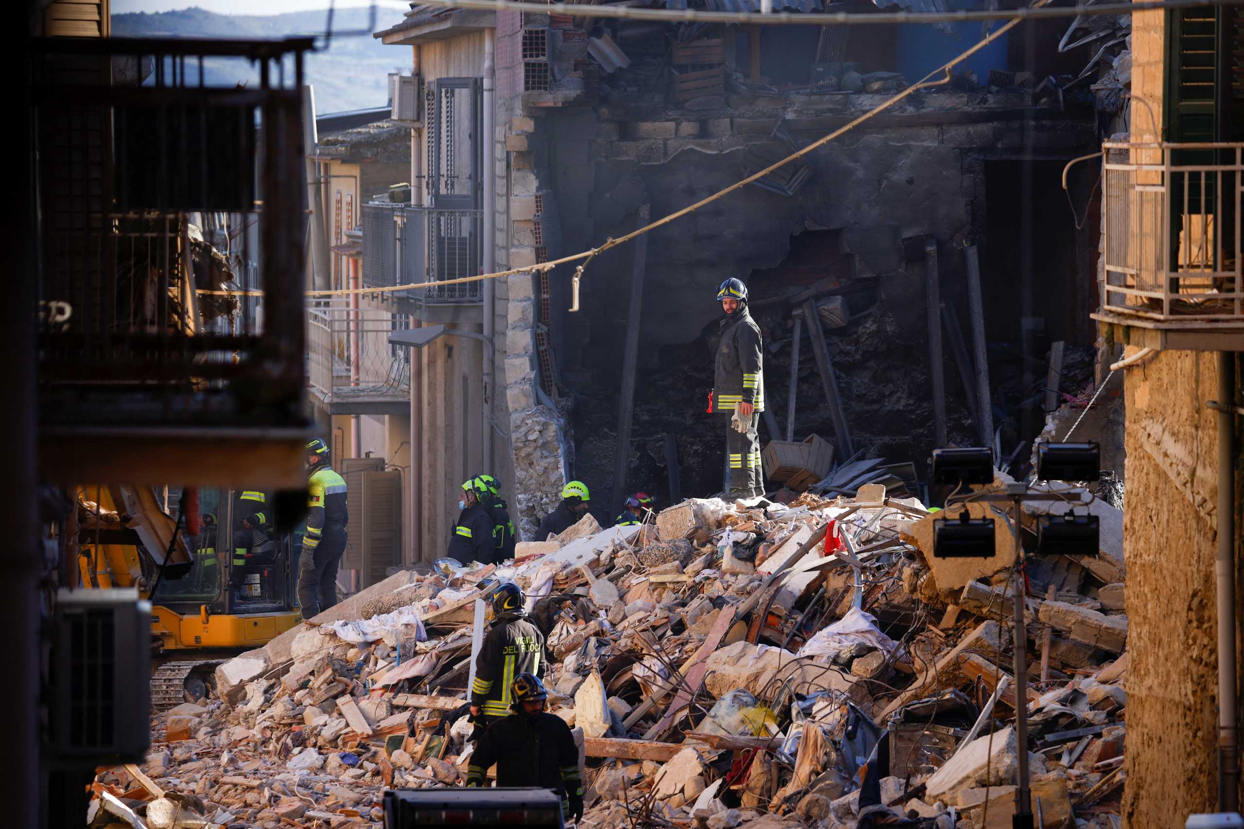 Rescuers work at the site of a gas explosion that caused several houses to collapse in Ravanusa, Italy, December 13, 2021. REUTERS