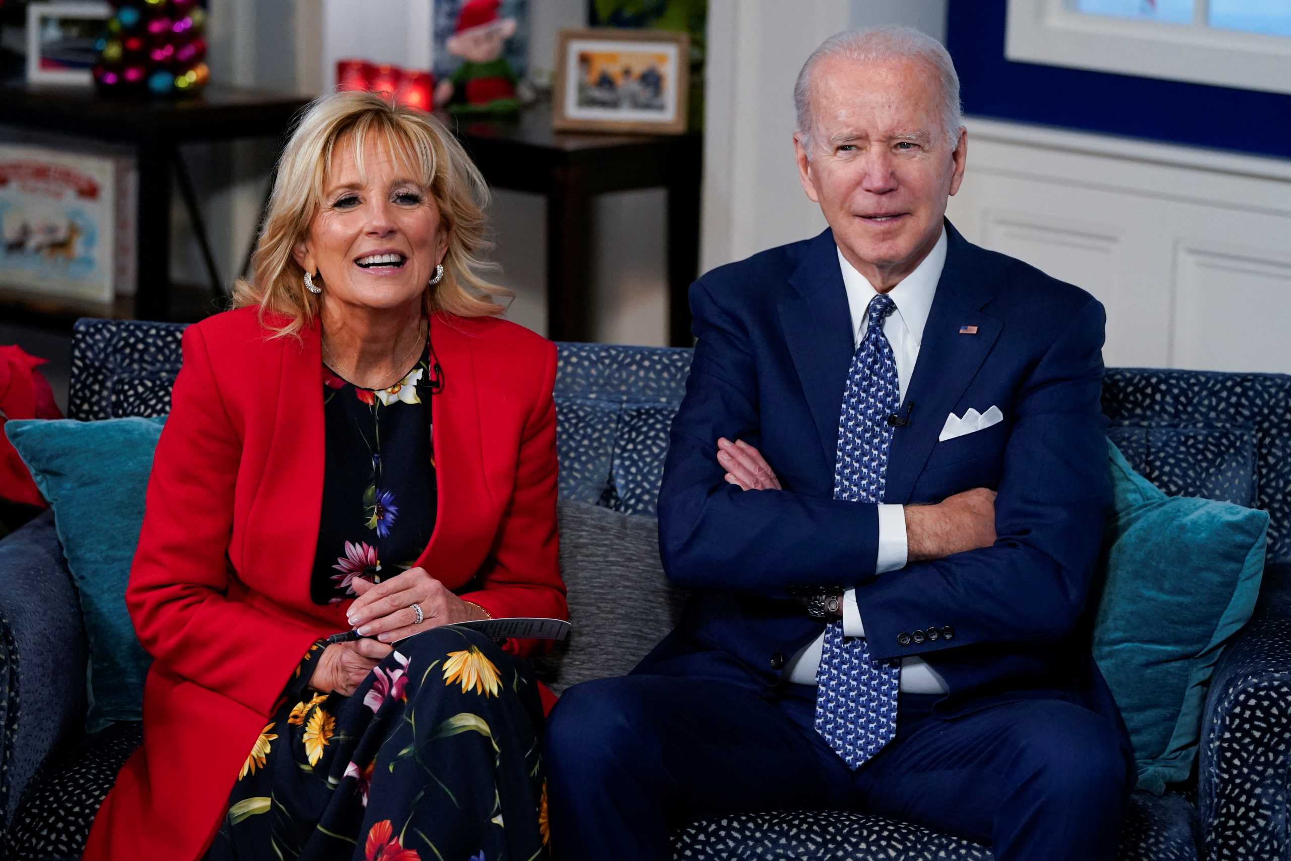 U.S. President Joe Biden and first lady Jill Biden participate in NORAD Santa tracker phone calls from South Court Auditorium at the White House in Washington, U.S., December 24, 2021. REUTERS