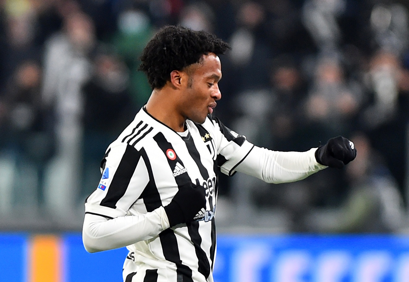 Soccer Football - Serie A - Juventus v Genoa - Allianz Stadium, Turin, Italy - December 5, 2021 Juventus' Juan Cuadrado celebrates scoring their first goal REUTERS