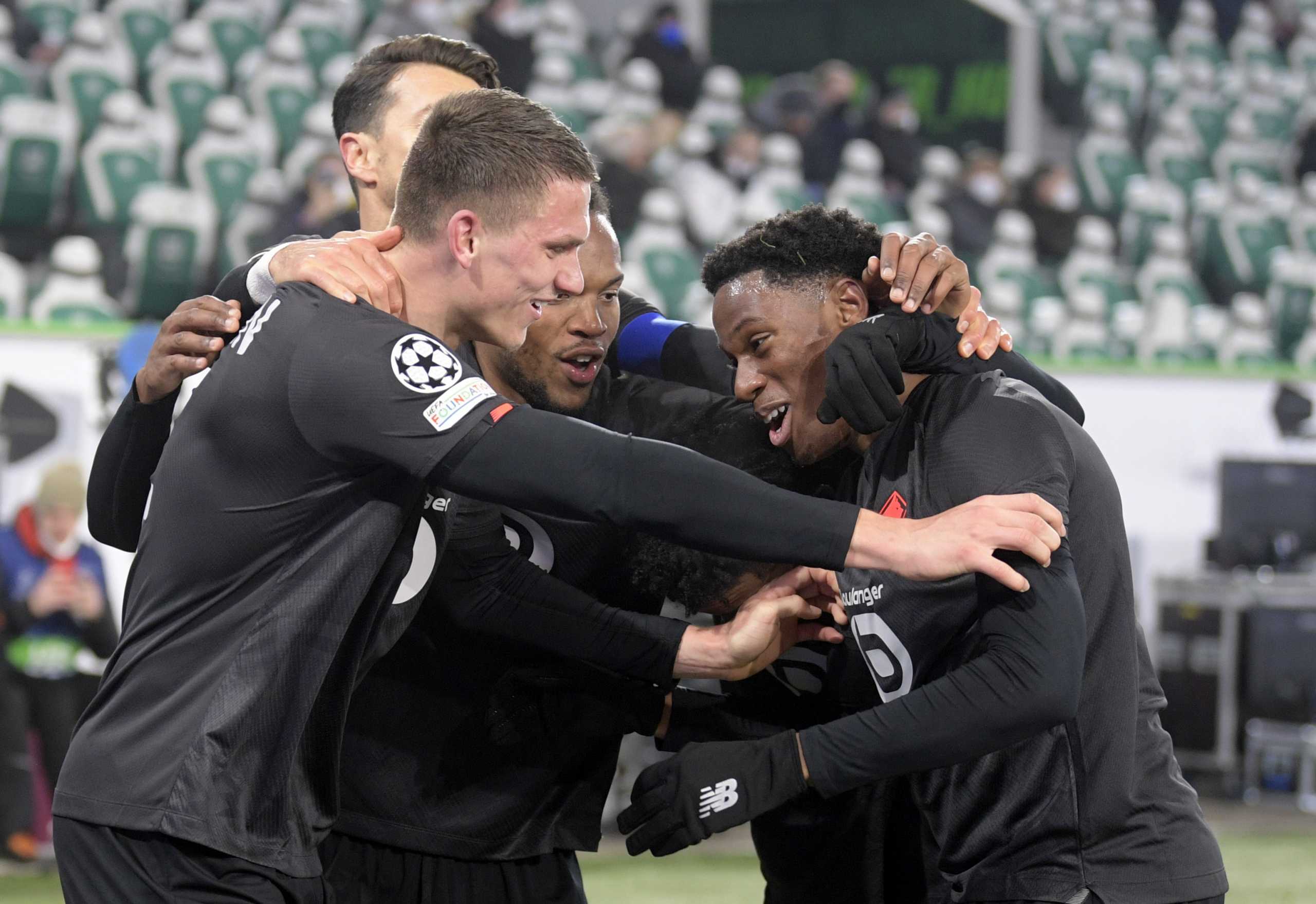 Soccer Football - Champions League - Group G - VfL Wolfsburg v Lille - Volkswagen Arena, Wolfsburg, Germany - December 8, 2021 Lille's Jonathan David celebrates scoring their second goal with teammates REUTERS