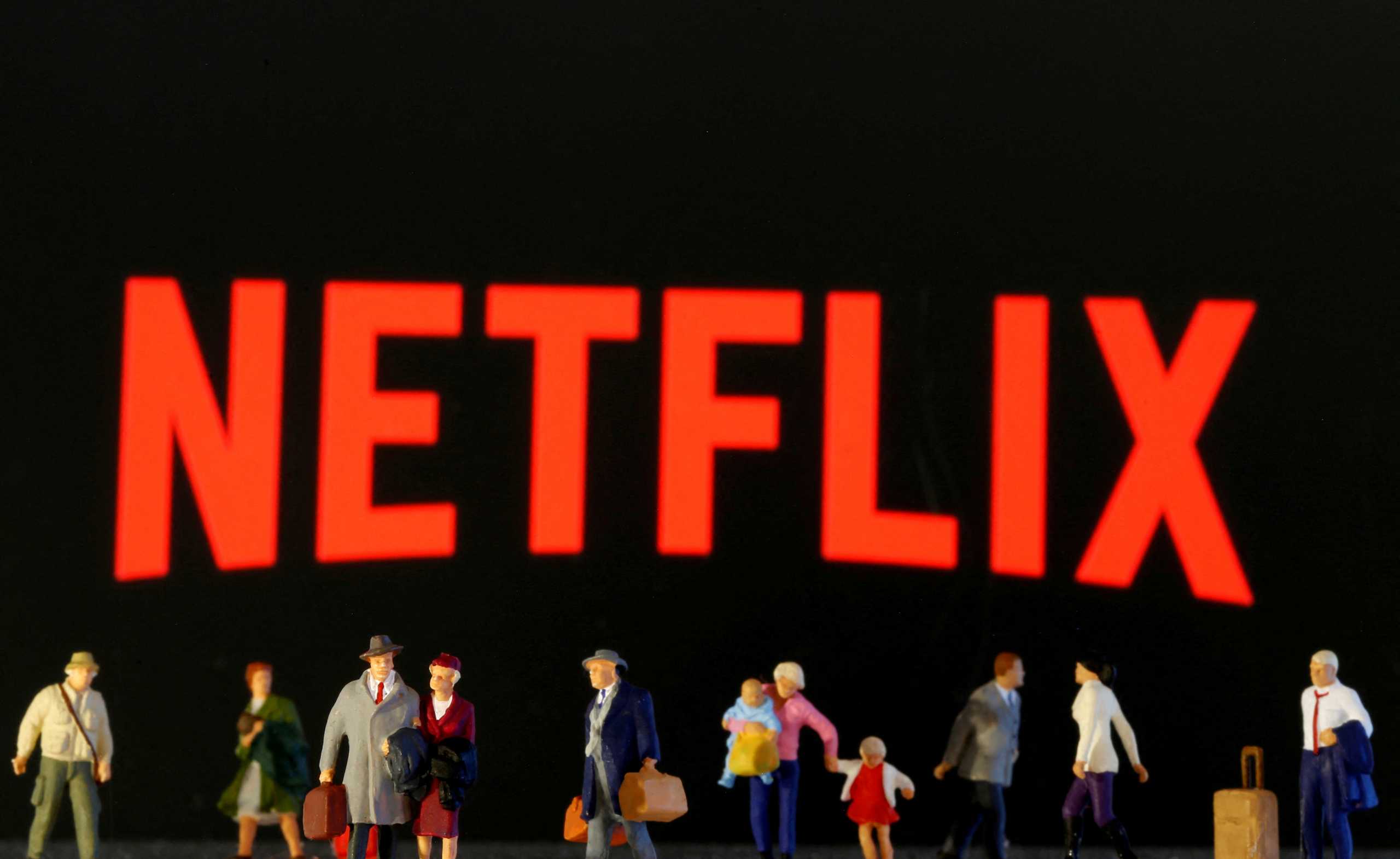 FILE PHOTO: Small toy figures are seen in front of diplayed Netflix logo in this illustration taken March 19, 2020. REUTERS
