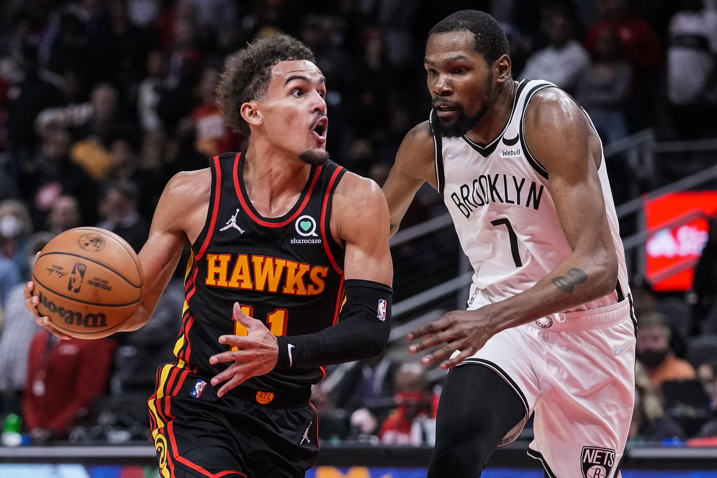 Dec 10, 2021; Atlanta, Georgia, USA; Atlanta Hawks guard Trae Young (11) tries to get to the basket guarded by Brooklyn Nets forward Kevin Durant (7) during the second half at State Farm Arena. Mandatory Credit: Dale Zanine-USA TODAY Sports