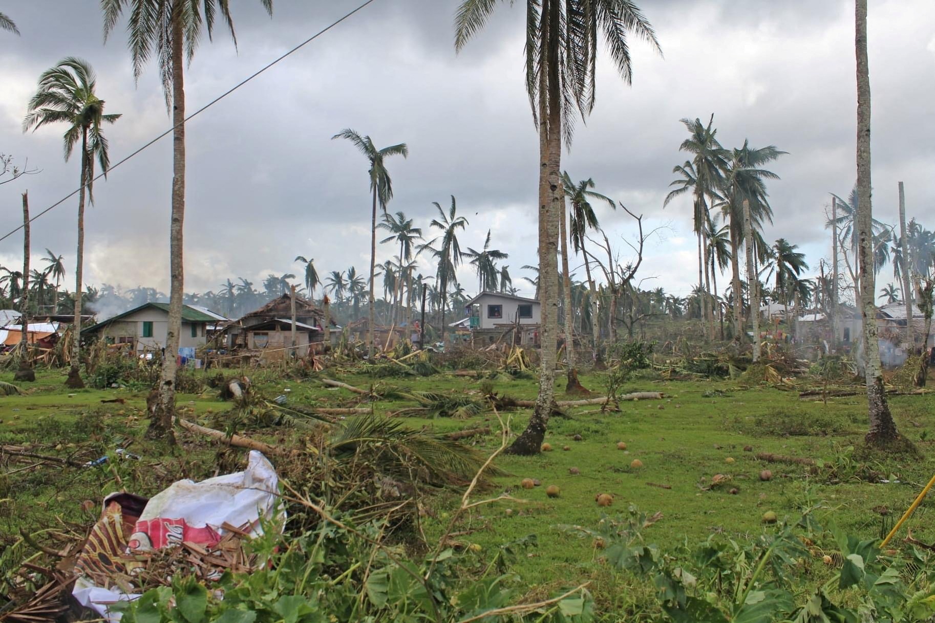 Houses and trees damaged by typhoon Rai are seen, in Surigao del Norte province, Philippines, December 18, 2021. Picture taken December 18, 2021. Philippine Coast Guard