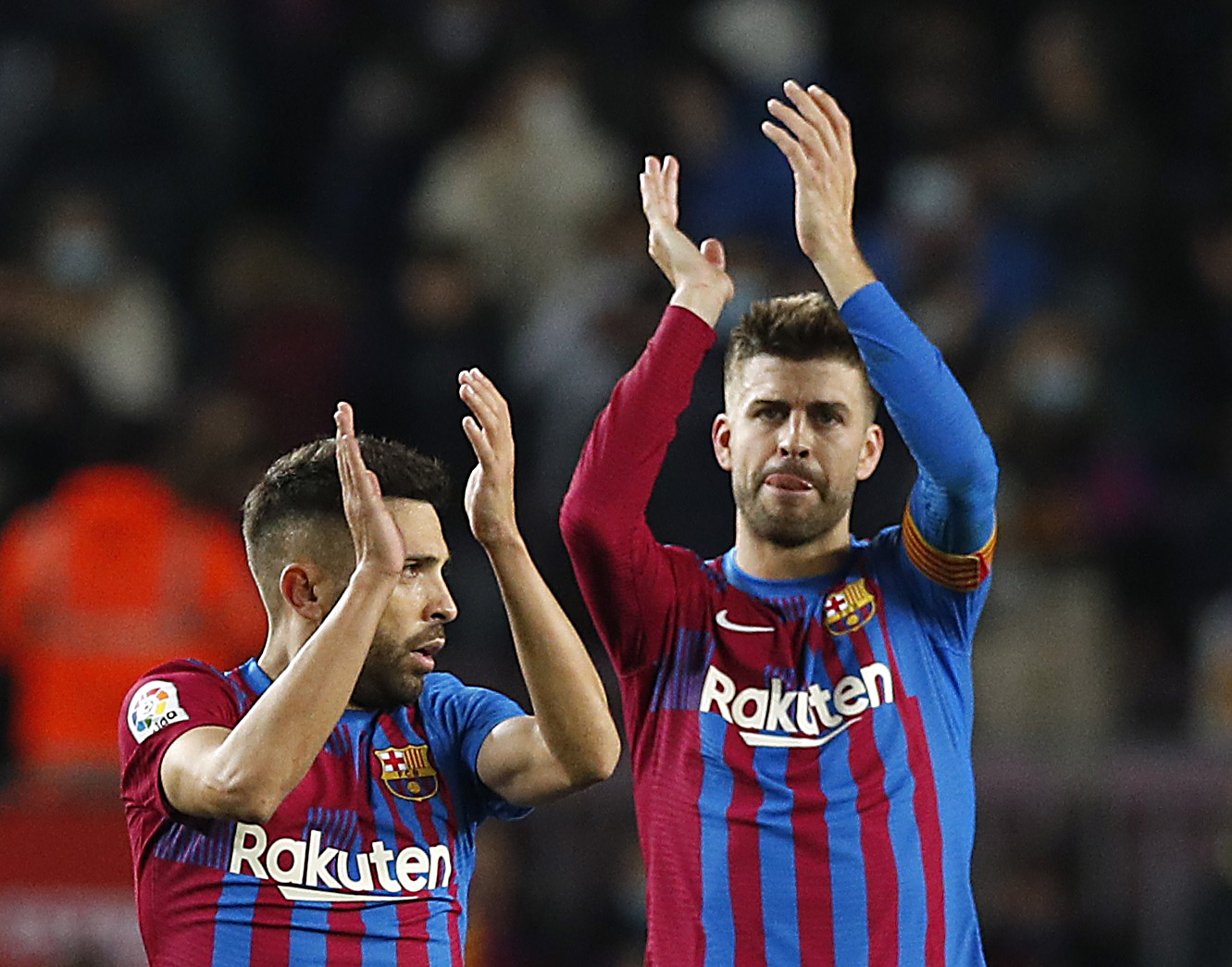 Soccer Football - LaLiga - FC Barcelona v Espanyol - Camp Nou, Barcelona, Spain - November 20, 2021  FC Barcelona's Jordi Alba and Gerard Pique applauds fans after the match REUTERS