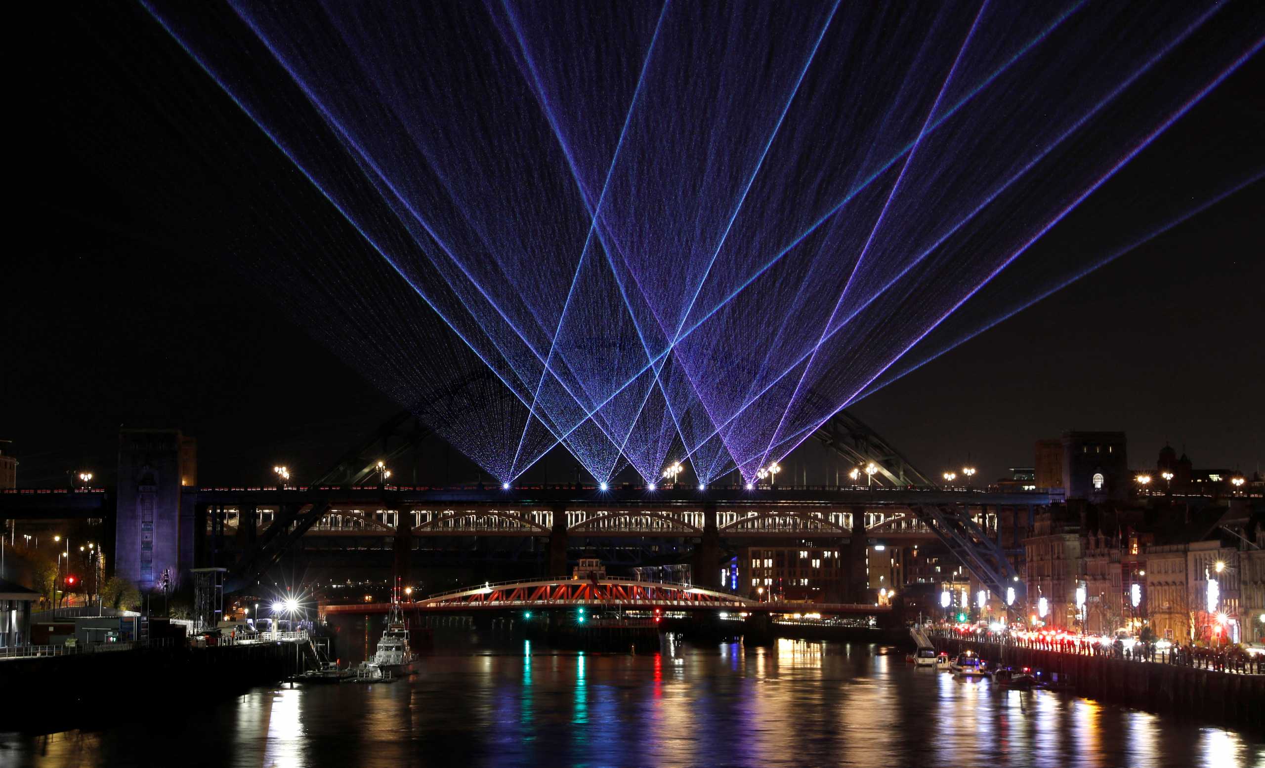 A laser show is seen designed by artist Seb Lee-Delisle and organised by Newcastle City Council to celebrate the New Year in Newcastle upon Tyne, Britain, December 30, 2021. REUTERS