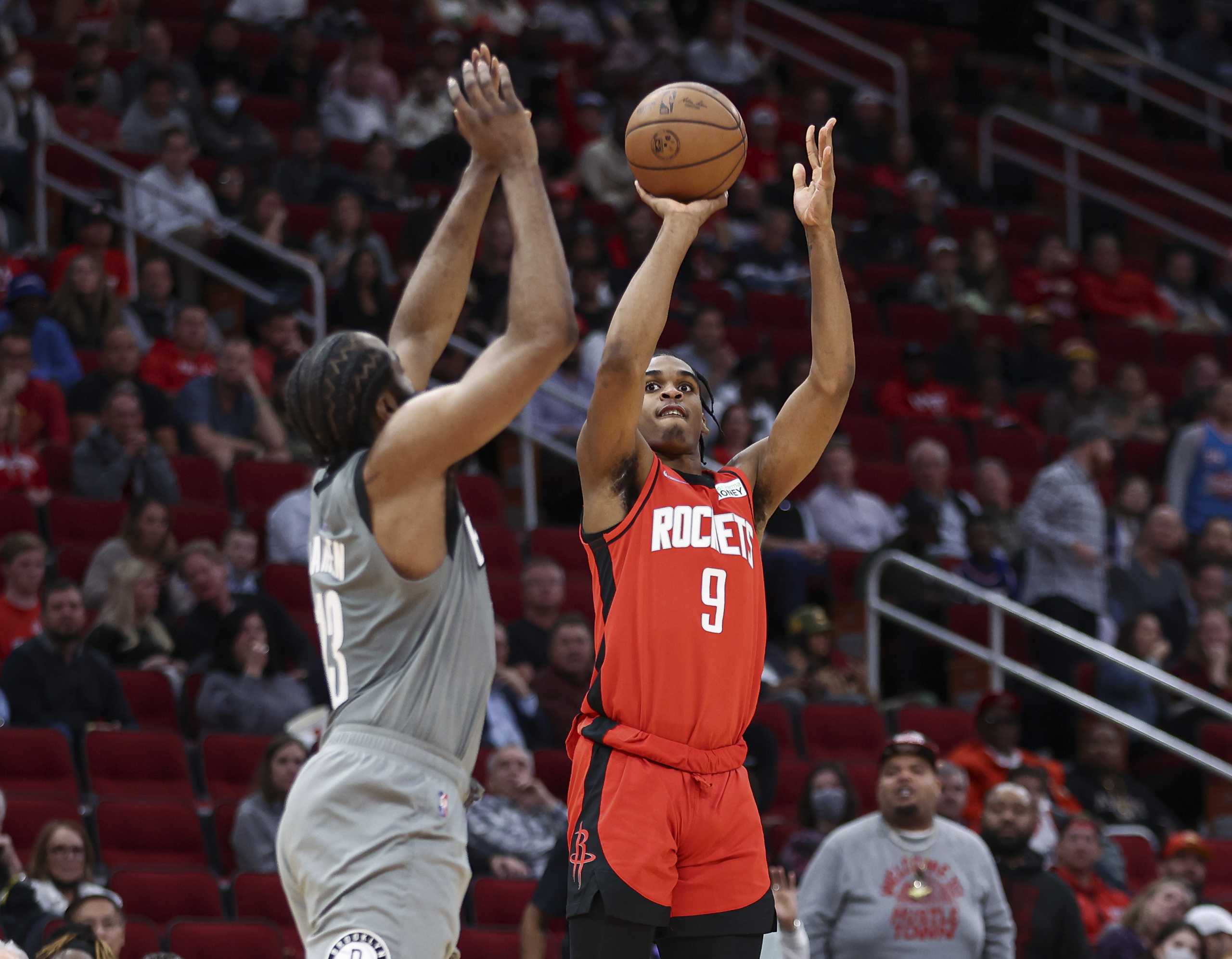 Dec 8, 2021; Houston, Texas, USA; Houston Rockets guard Josh Christopher (9) shoots the ball during the second quarter as Brooklyn Nets guard James Harden (13) defends at Toyota Center. Mandatory Credit: Troy Taormina-USA TODAY Sports