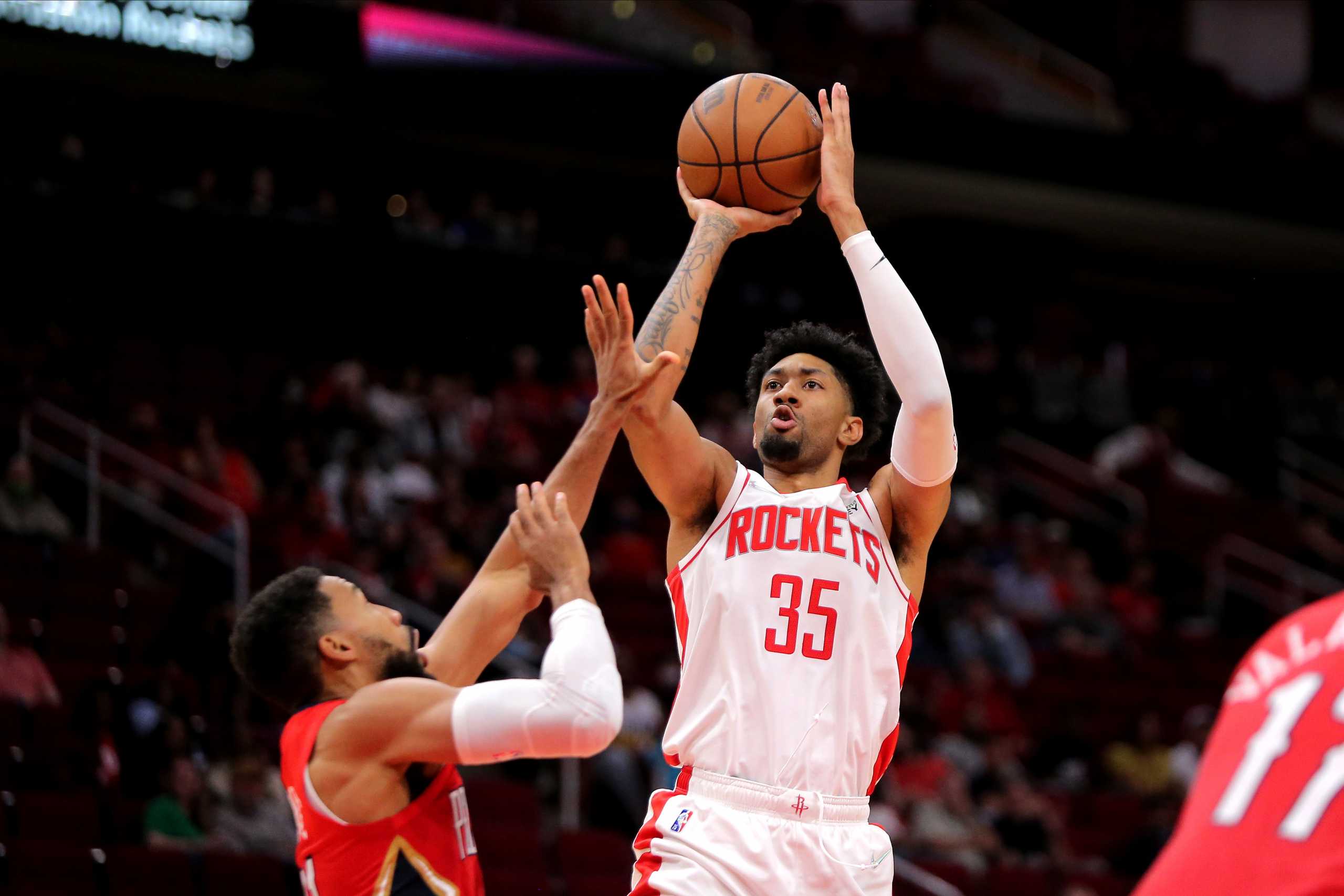 Dec 5, 2021; Houston, Texas, USA; Houston Rockets center Christian Wood (35) takes an outside shot while New Orleans Pelicans forward Garrett Temple (41) defends during the fourth quarter at Toyota Center. Mandatory Credit: Erik Williams-USA TODAY Sports