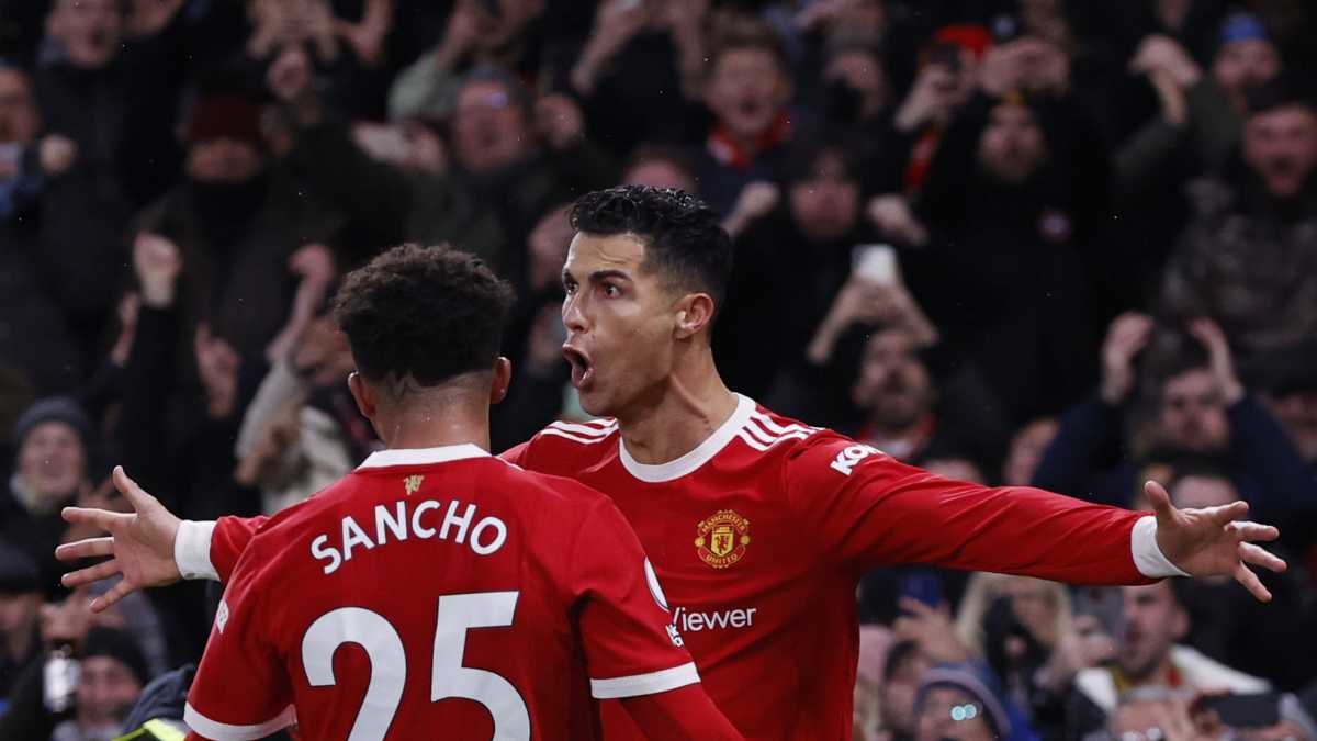 Soccer Football - Premier League - Manchester United v Arsenal - Old Trafford, Manchester, Britain - December 2, 2021 Manchester United's Cristiano Ronaldo celebrates scoring their third goal with Jadon Sancho REUTERS