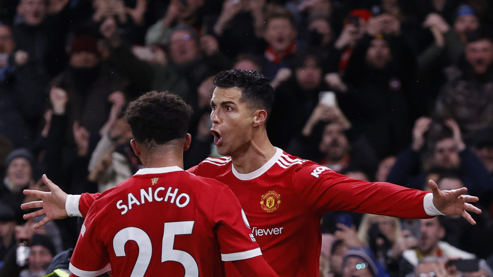 Soccer Football - Premier League - Manchester United v Arsenal - Old Trafford, Manchester, Britain - December 2, 2021 Manchester United's Cristiano Ronaldo celebrates scoring their third goal with Jadon Sancho REUTERS