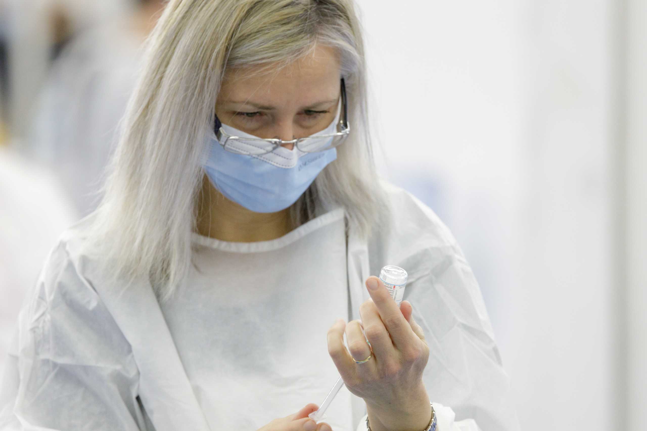 A medical staff prepares a dose of the coronavirus disease (COVID-19) vaccine at a vaccination center in Zagreb, Croatia, November 15, 2021. REUTERS