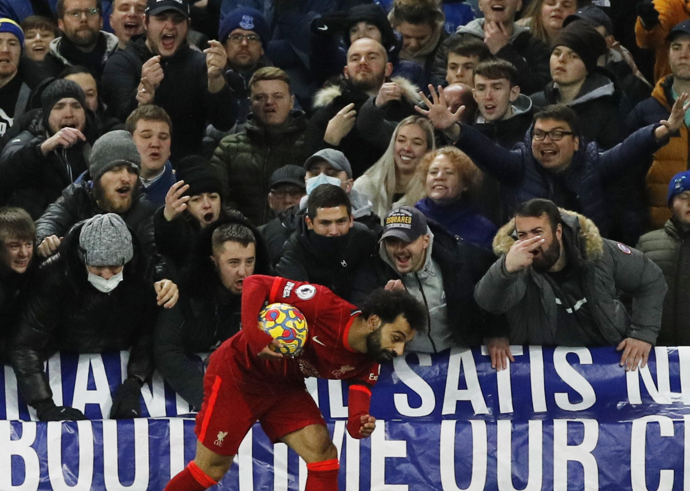 Soccer Football - Premier League - Everton v Liverpool - Goodison Park, Liverpool, Britain - December 1, 2021 Everton fans react and gesture towards Liverpool's Mohamed Salah during the match REUTERS