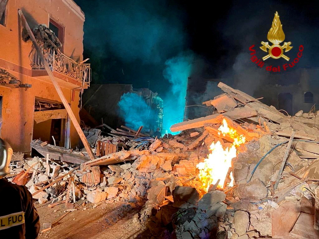Debris is seen after a four-storey building collapsed in the Sicilian town of Ravanusa following a gas explosion, in Italy, in this undated image obtained via social media on December 12, 2021.  Vigili del Fuoco via REUTERS ATTENTION EDITORS - THIS IMAGE HAS BEEN SUPPLIED BY A THIRD PARTY. WATERMARK FROM SOURCE. DO NOT OBSCURE LOGO.