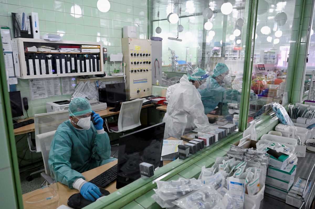 FILE PHOTO: Health workers are seen at work as the Slovak government mandates further restrictions to curb the spread of COVID-19), in Trencin, Slovakia, November 25, 2021. REUTERS