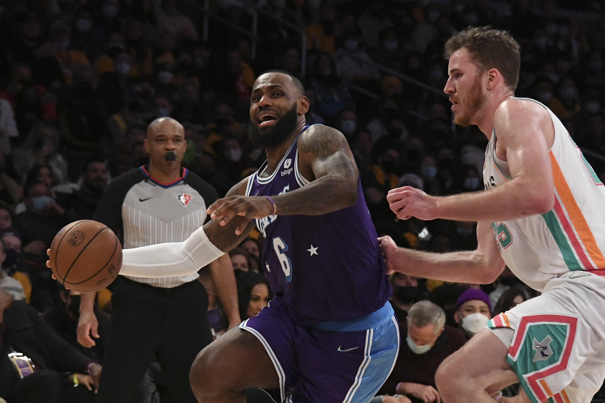 Dec 23, 2021; Los Angeles, California, USA;  Los Angeles Lakers forward Lebron James (6) drives past San Antonio Spurs center Jakob Poeltl (25) during the fourth quarter at Staples Center. Mandatory Credit: Richard Mackson-USA TODAY Sports