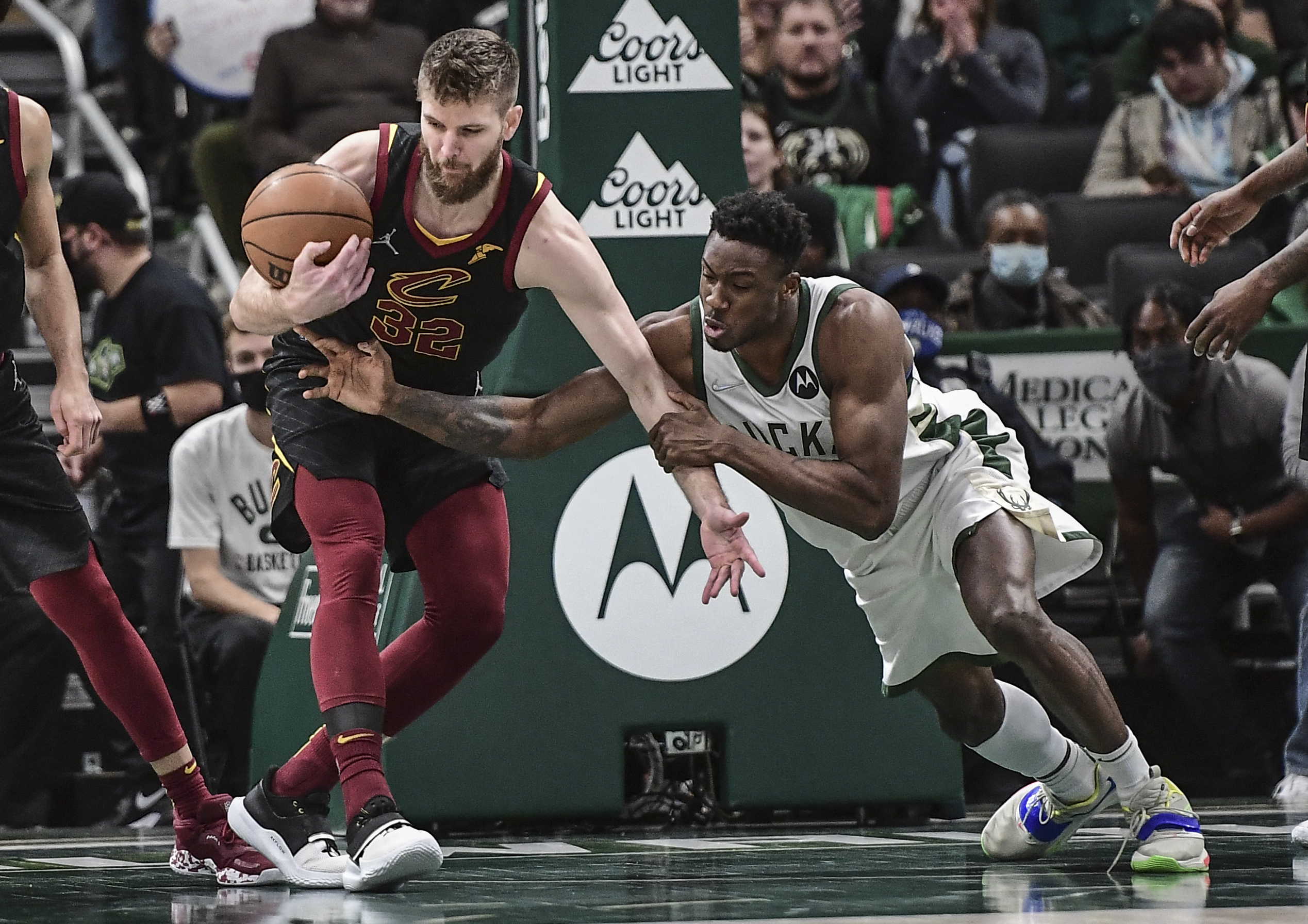 Dec 18, 2021; Milwaukee, Wisconsin, USA;  Milwaukee Bucks forward Thanasis Antetokounmpo (43) tries to steal the ball from Cleveland Cavaliers forward Dean Wade (32) in the third quarter at Fiserv Forum. Mandatory Credit: Benny Sieu-USA TODAY Sports