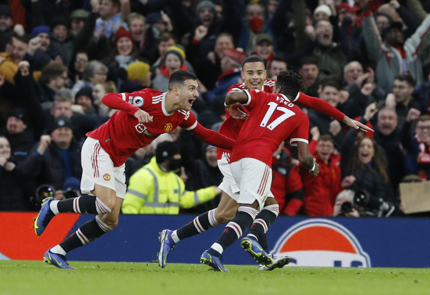 Soccer Football - Premier League - Manchester United v Crystal Palace - Old Trafford, Manchester, Britain - December 5, 2021 Manchester United's Fred celebrates scoring their first goal with Mason Greenwood and Diogo Dalot REUTERS