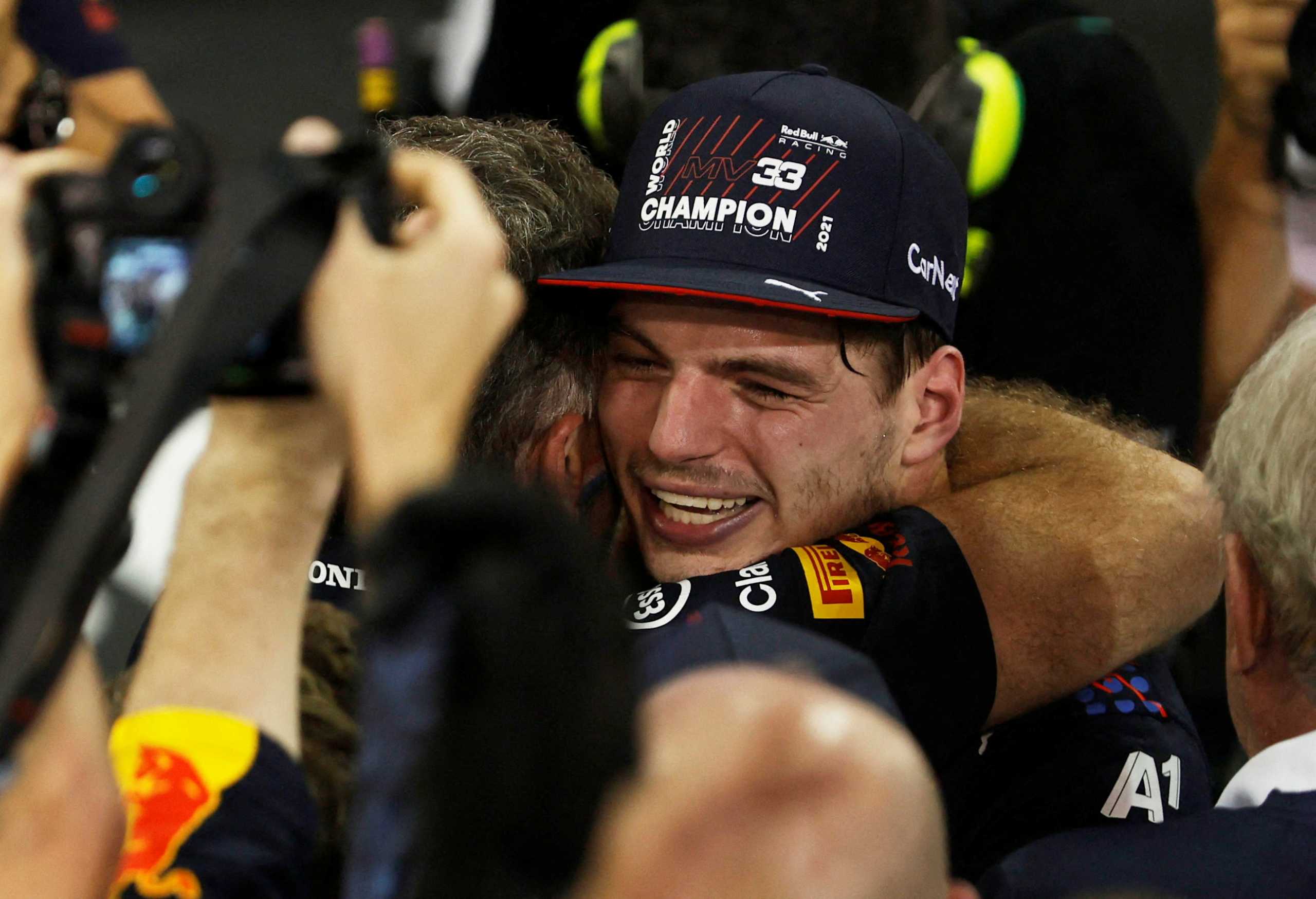 Formula One F1 - Abu Dhabi Grand Prix - Yas Marina Circuit, Abu Dhabi, United Arab Emirates - December 12, 2021 Red Bull's Max Verstappen celebrates winning the race and the world championship REUTERS