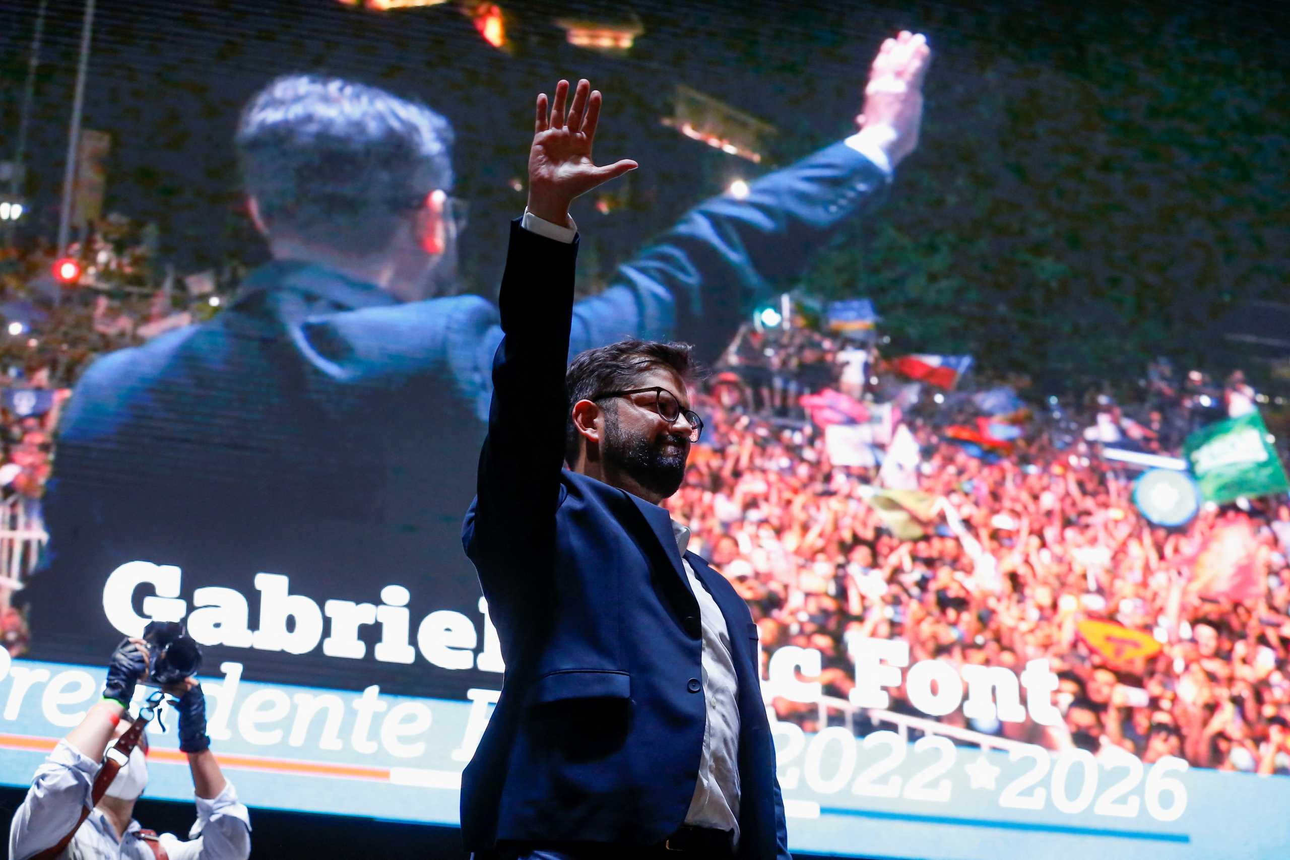 Chile's President-elect Gabriel Boric gestures as he celebrates with supporters after winning the presidential election in Santiago, Chile, December 19, 2021. REUTERS