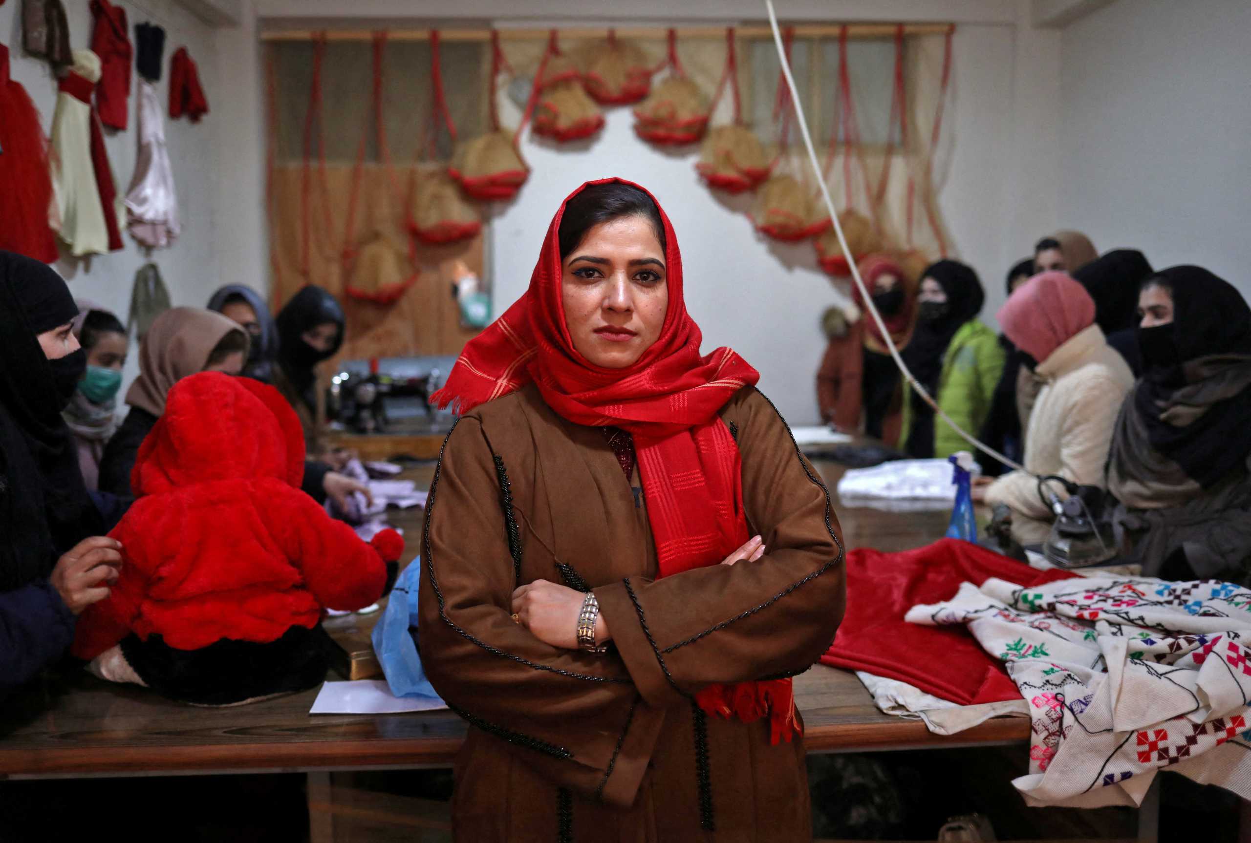 Sohaila Noori, 29, owner of a sewing workshop, poses at her workshop in Kabul, Afghanistan January 15, 2022. Picture taken January 15, 2022. REUTERS