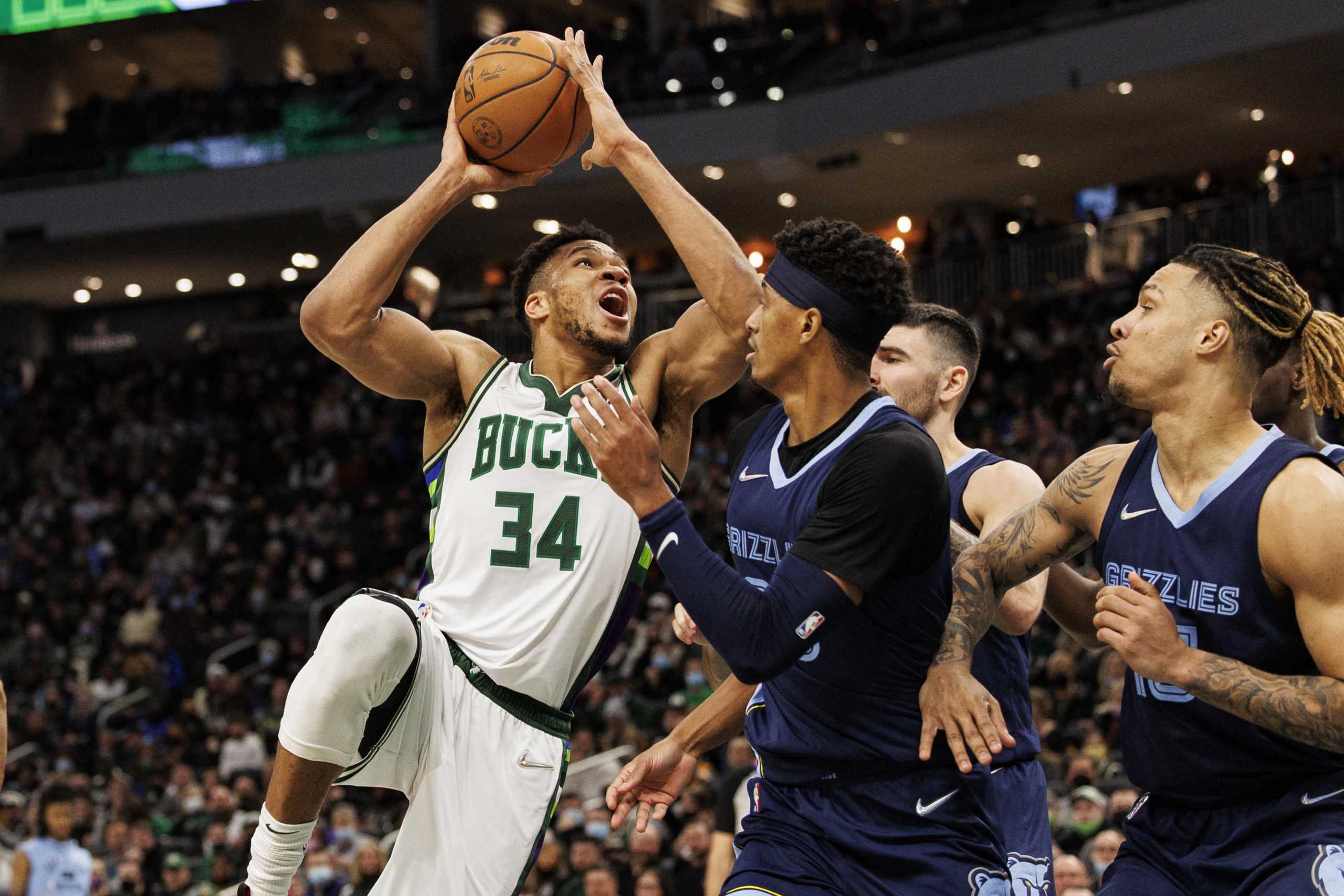 Jan 19, 2022; Milwaukee, Wisconsin, USA;  Milwaukee Bucks forward Giannis Antetokounmpo (34) shoots during the fourth quarter against the Memphis Grizzlies at Fiserv Forum. Mandatory Credit: Jeff Hanisch-USA TODAY Sports